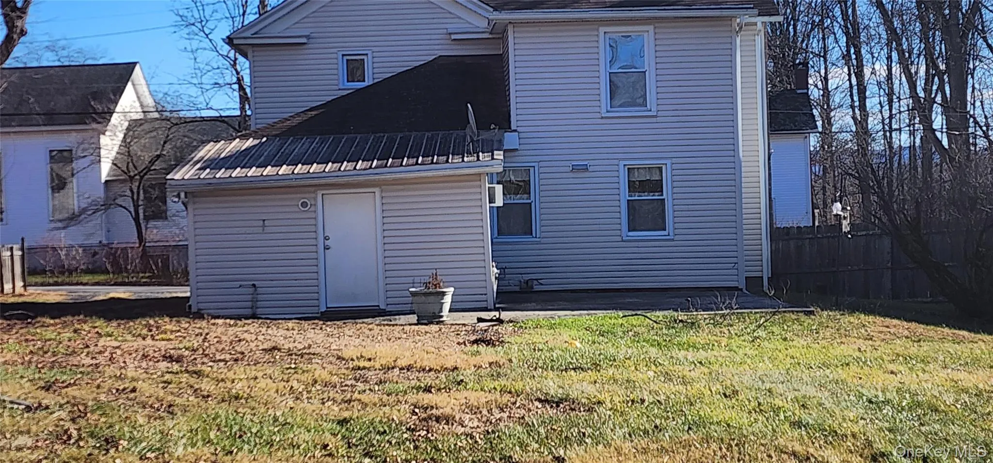 Rear view of property with a fenced backyard and a patio area Rear view of property with a fenced backyard and a patio area