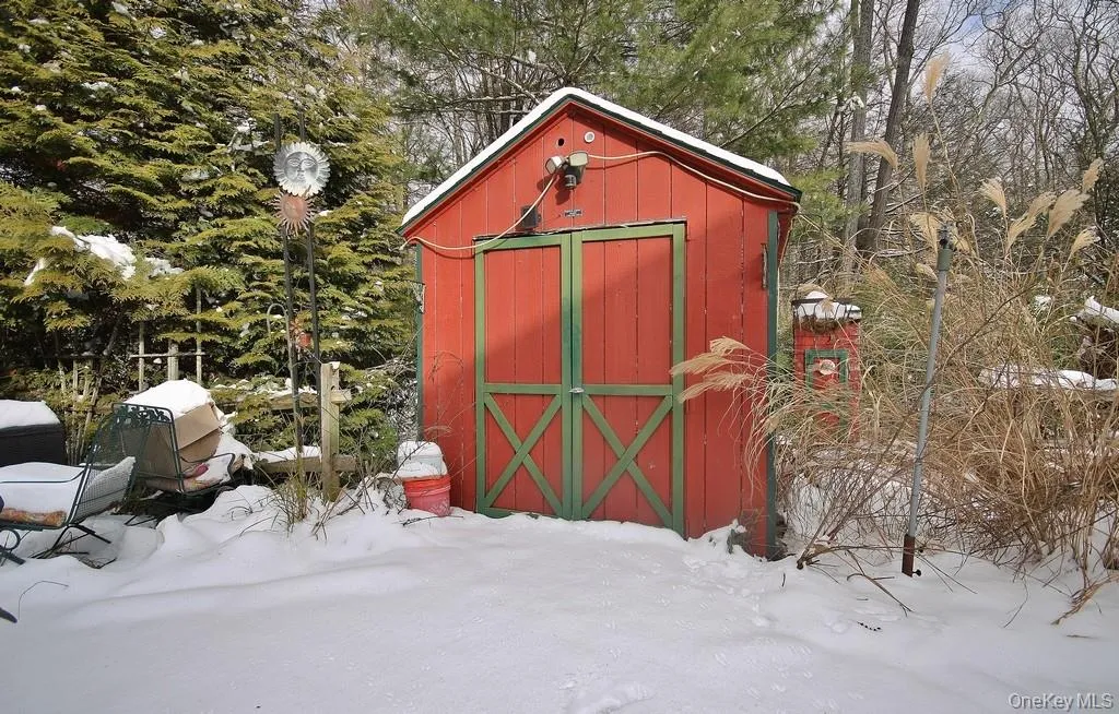 Snow covered structure with a storage shed Snow covered structure with a storage shed