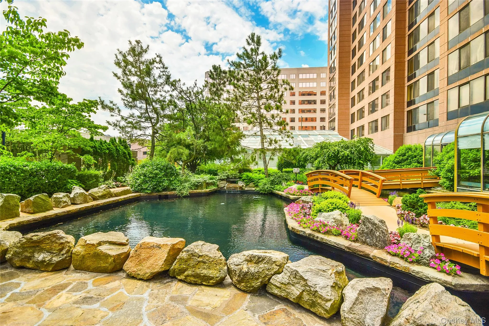 Swimming pool with a small pond Swimming pool with a small pond