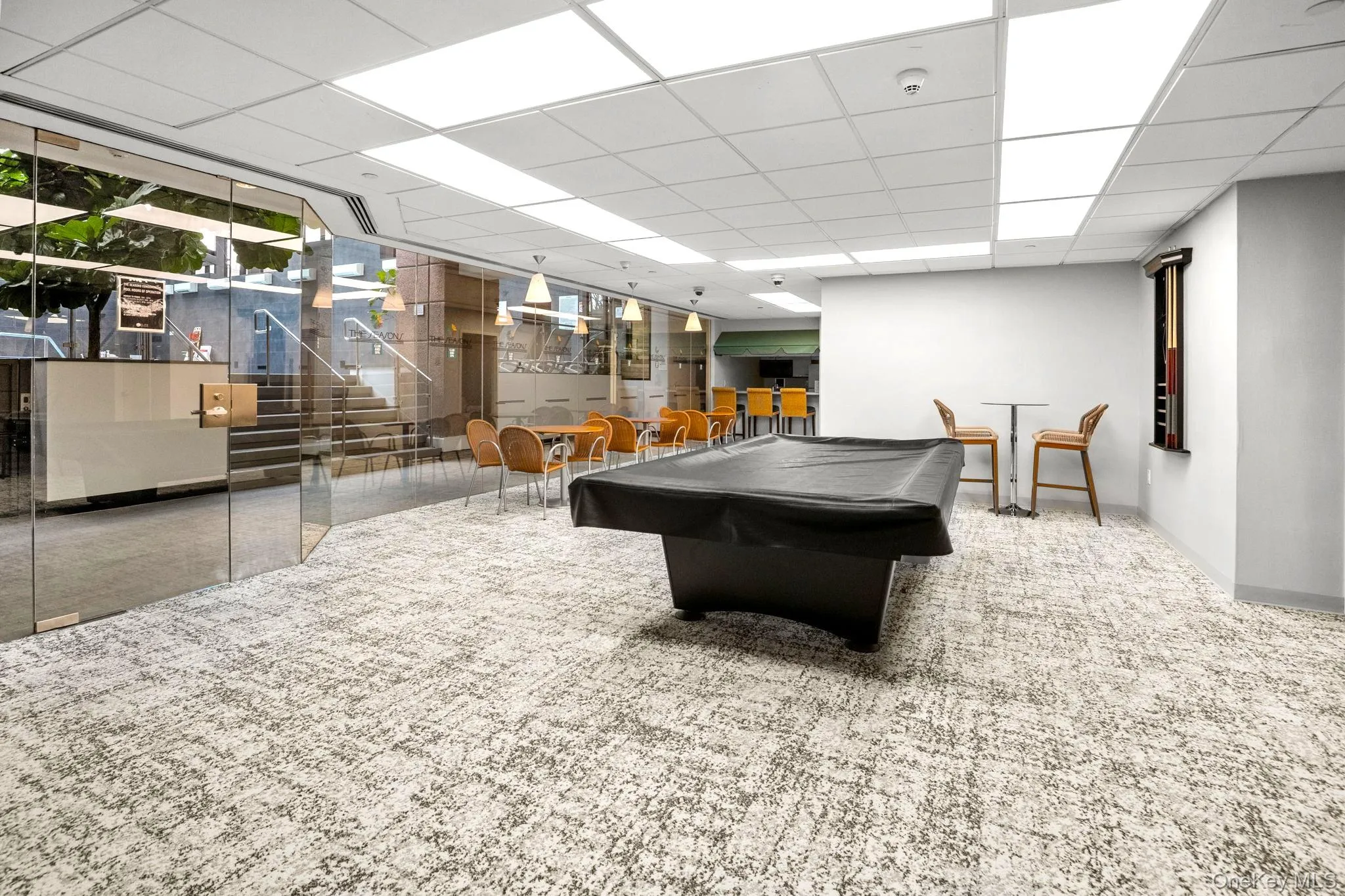 Game room featuring billiards table and a drop ceiling Game room featuring billiards table and a drop ceiling