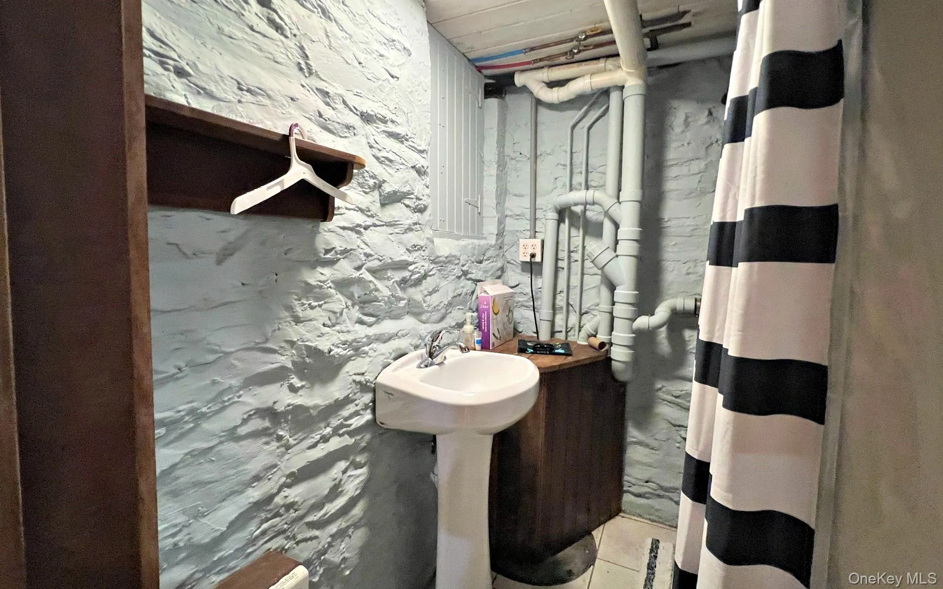 Full bathroom with curtained shower Full bathroom with curtained shower