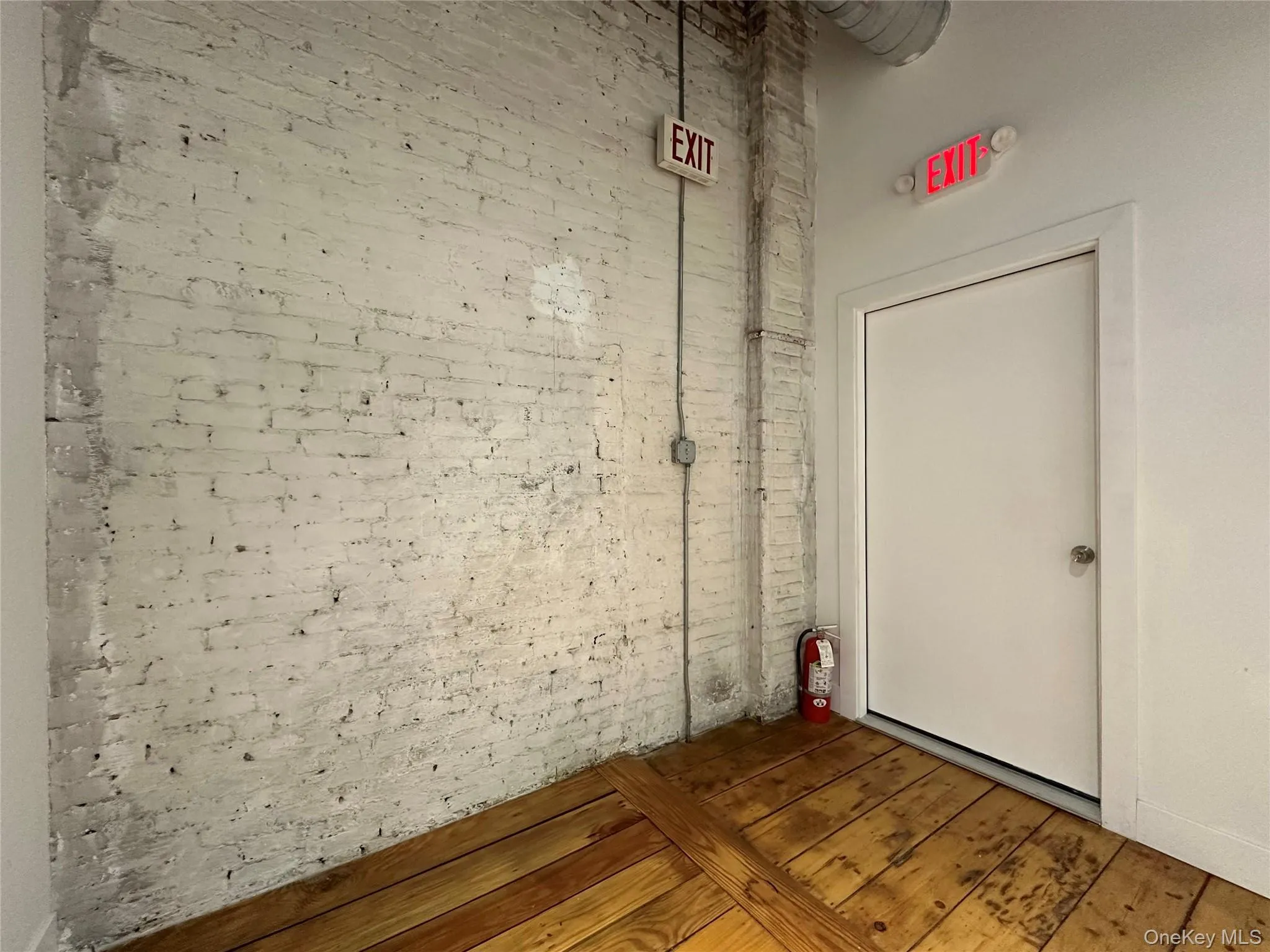 Empty room featuring hardwood / wood-style floors Empty room featuring hardwood / wood-style floors