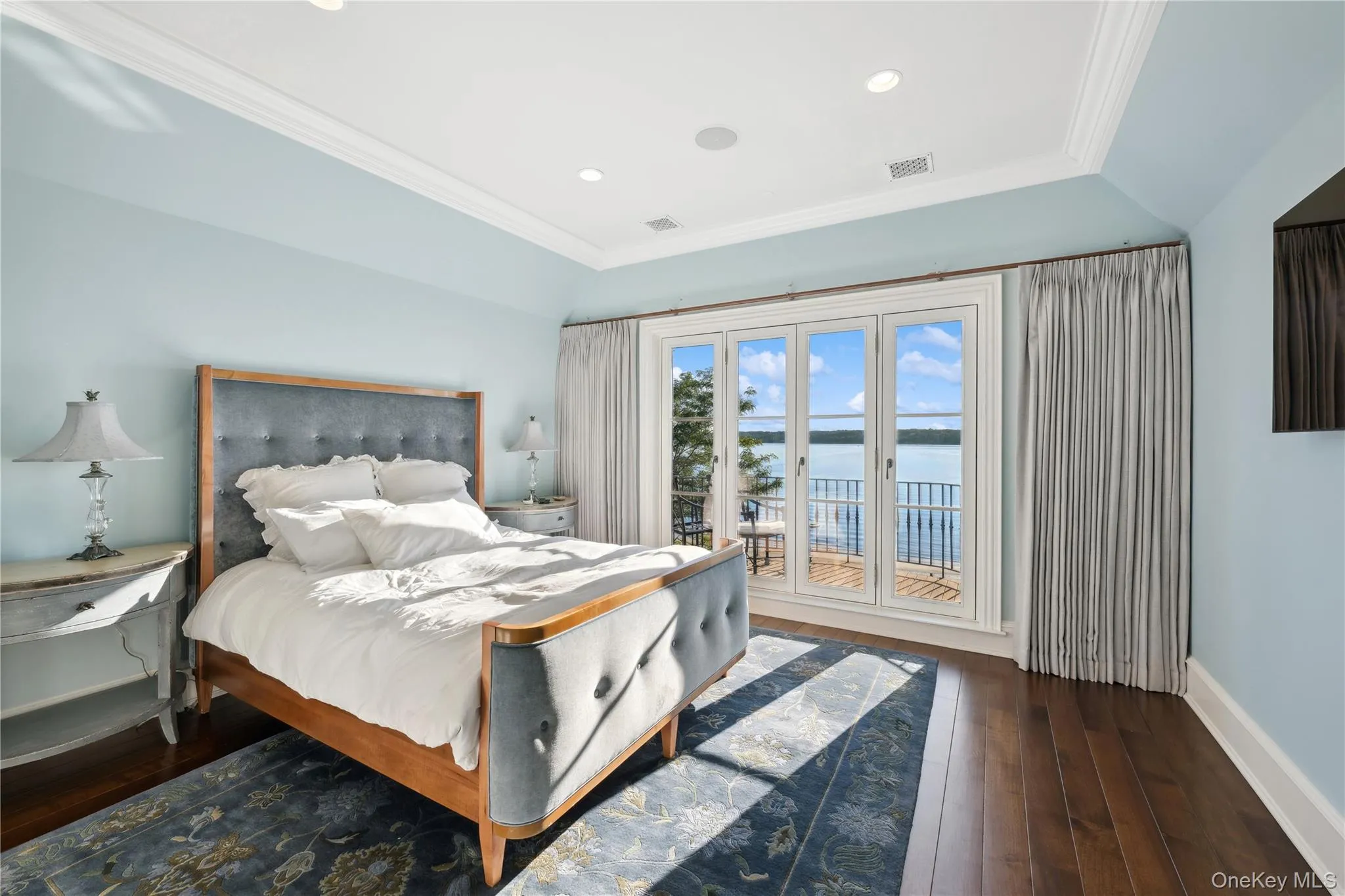 Bedroom with access to exterior, dark wood finished floors, ornamental molding, recessed lighting, and lofted ceiling Bedroom with access to exterior, dark wood finished floors, ornamental molding, recessed lighting, and lofted ceiling