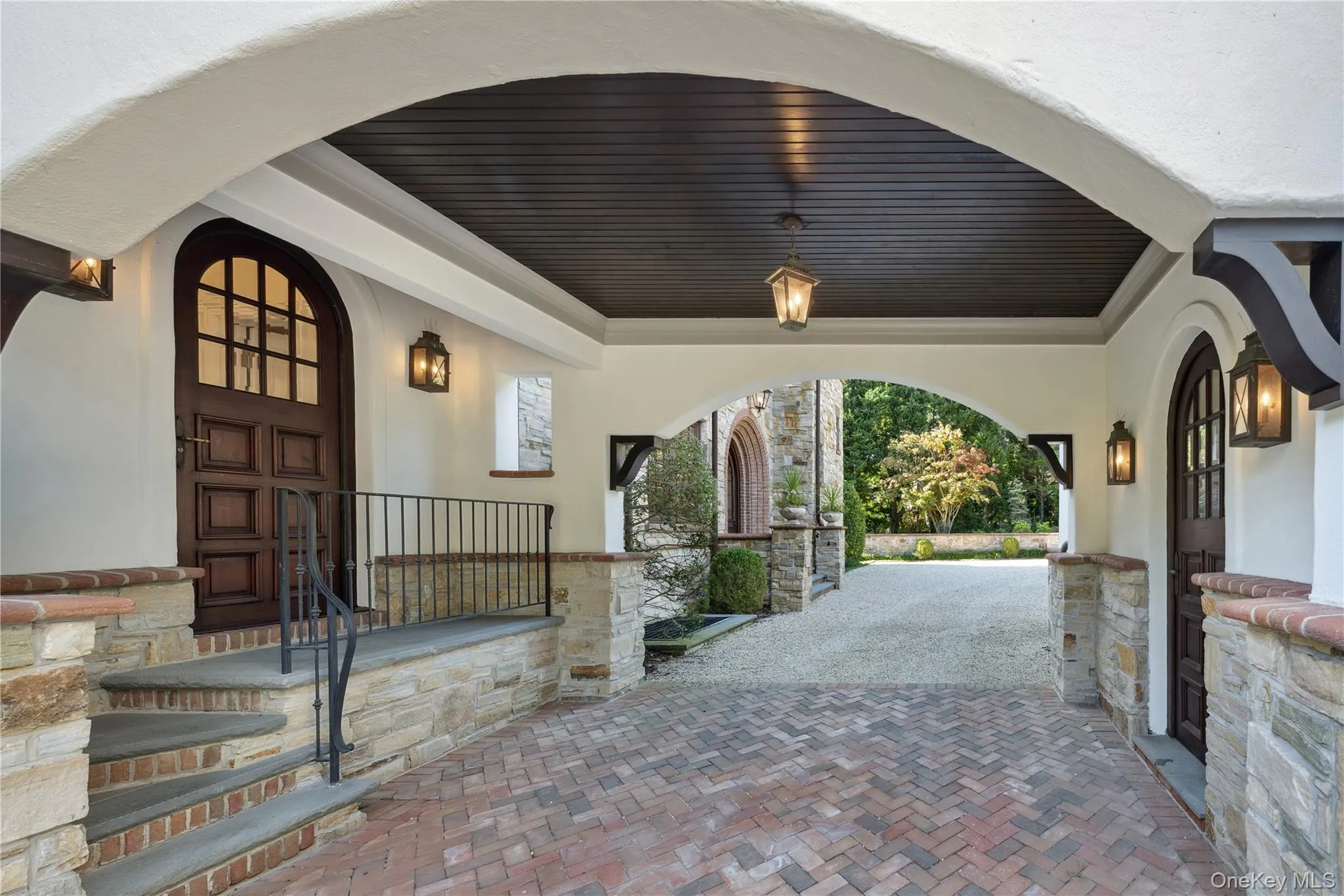 Property entrance with stucco siding and covered porch Property entrance with stucco siding and covered porch