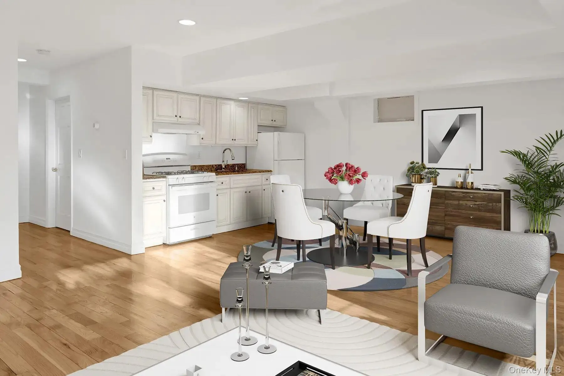 Living room with light wood finished floors and recessed lighting Living room with light wood finished floors and recessed lighting