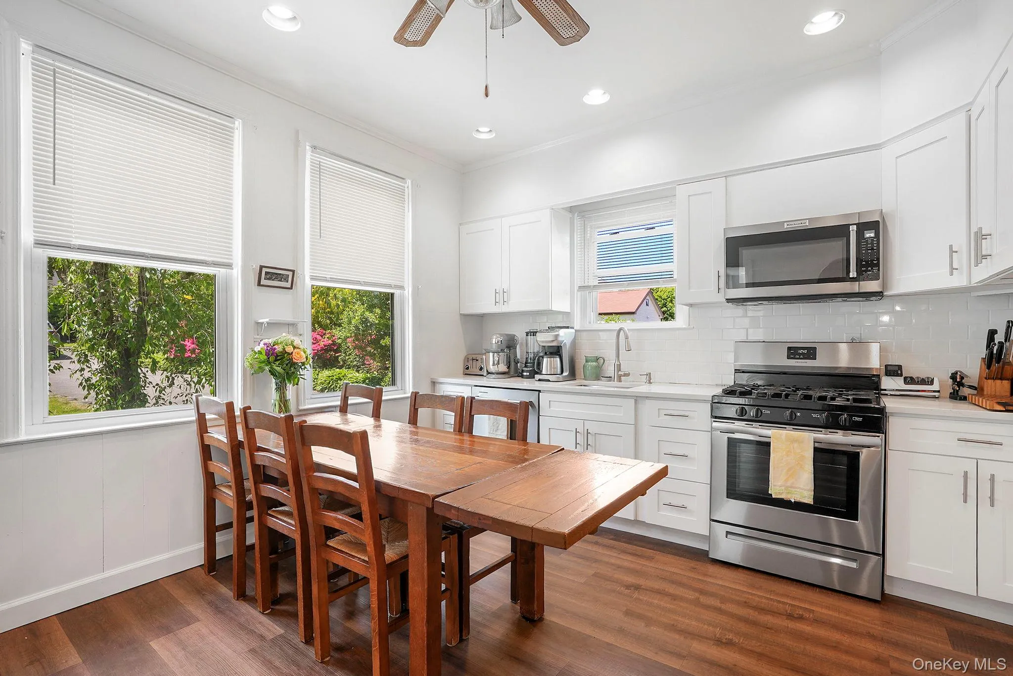 Updated eat-in-kitchen with quartz counters and stainless-steel appliances Updated eat-in-kitchen with quartz counters and stainless-steel appliances