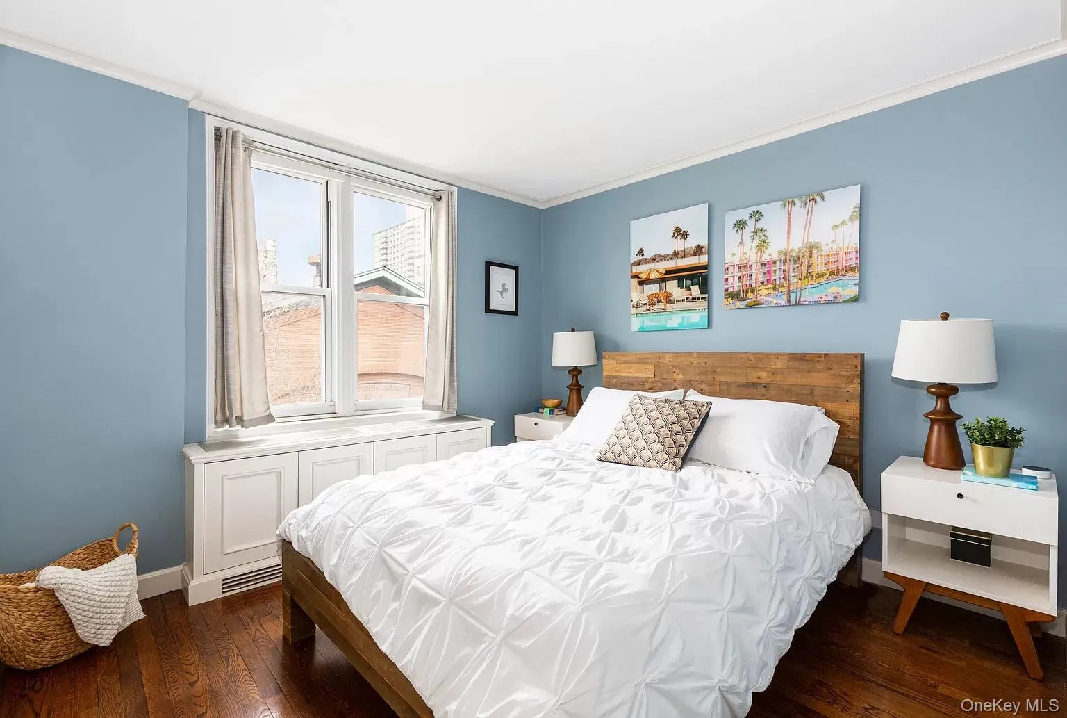 Bedroom featuring crown molding and dark wood-style flooring Bedroom featuring crown molding and dark wood-style flooring