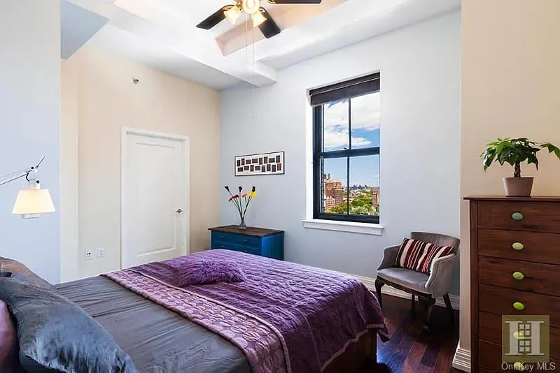 Bedroom with hardwood / wood-style floors and a ceiling fan Bedroom with hardwood / wood-style floors and a ceiling fan