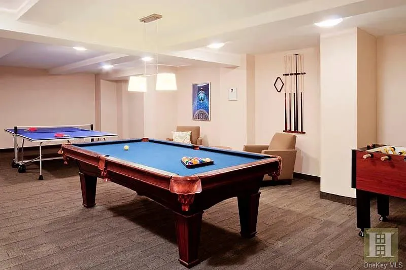 Game room with carpet and billiards table Game room with carpet and billiards table