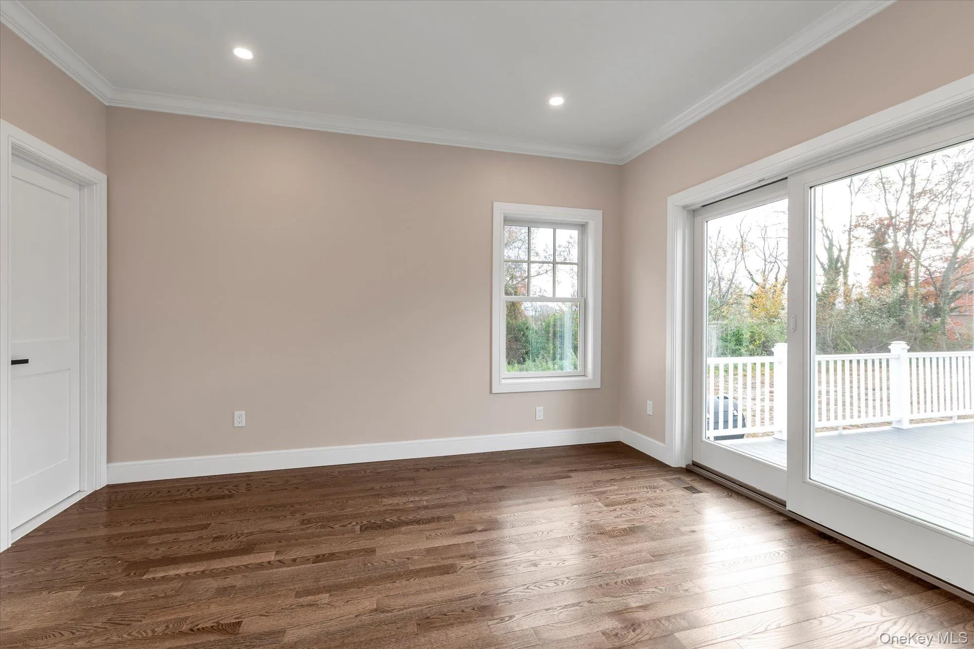 Spare room with wood finished floors, recessed lighting, and ornamental molding Spare room with wood finished floors, recessed lighting, and ornamental molding