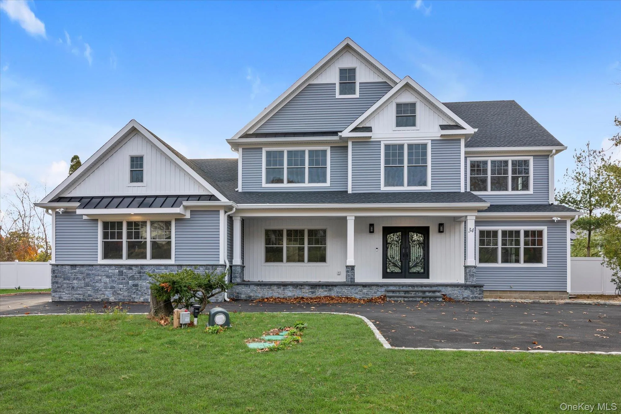 View of front of house featuring a porch, a shingled roof, and french doors View of front of house featuring a porch, a shingled roof, and french doors