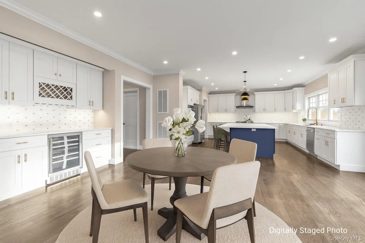 Dining room featuring ornamental molding, wine cooler, dark wood finished floors, a bar, and recessed lighting Dining room featuring ornamental molding, wine cooler, dark wood finished floors, a bar, and recessed lighting