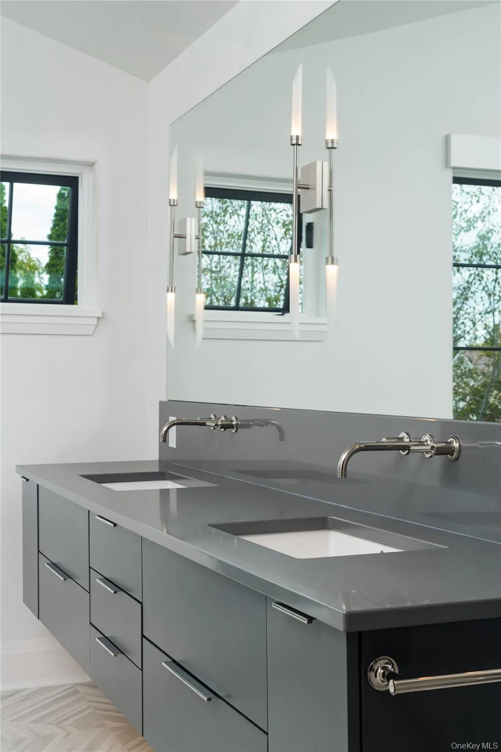 Full bathroom featuring double vanity and healthy amount of natural light Full bathroom featuring double vanity and healthy amount of natural light