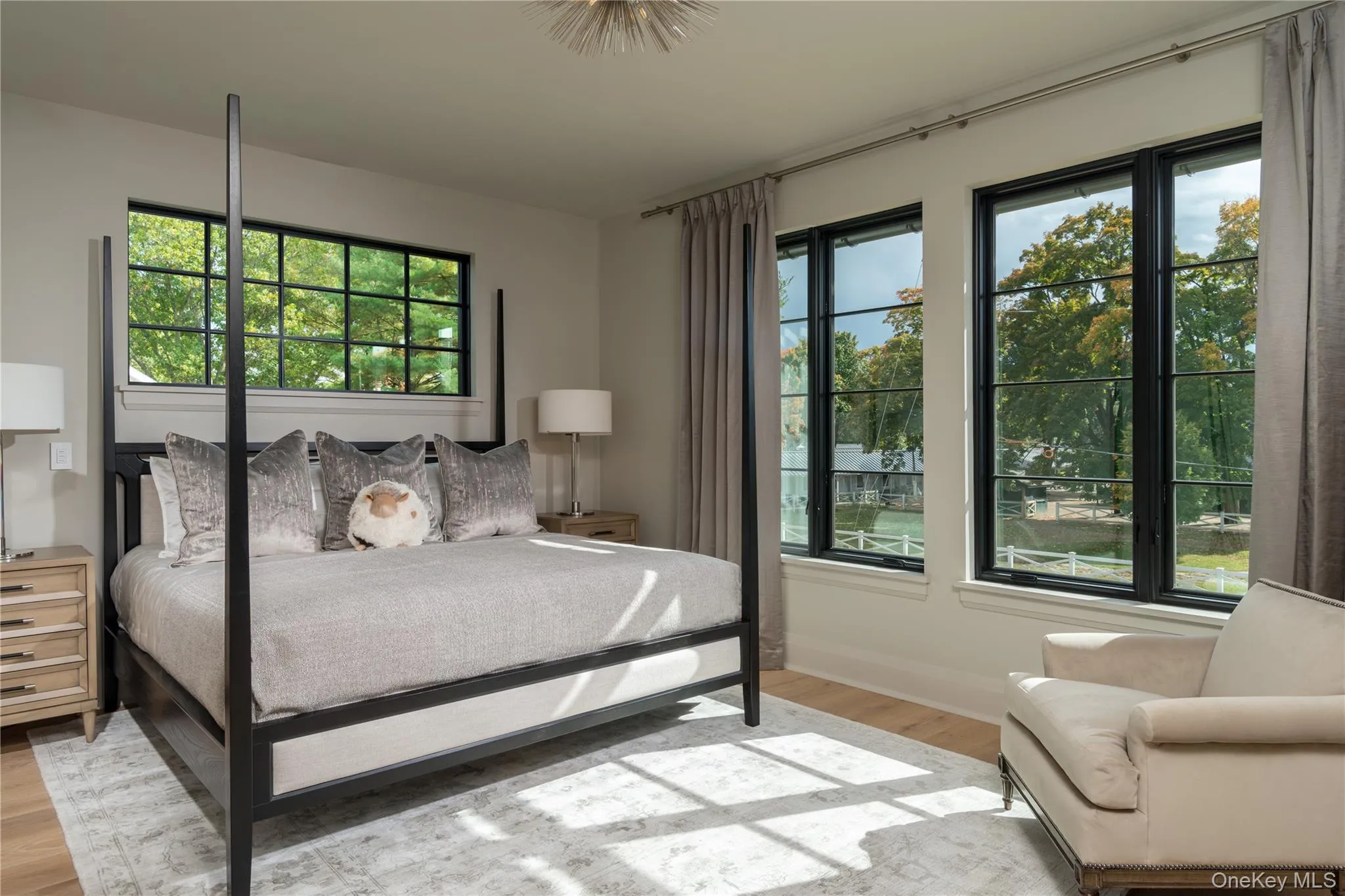 Bedroom featuring light wood finished floors and baseboards Bedroom featuring light wood finished floors and baseboards