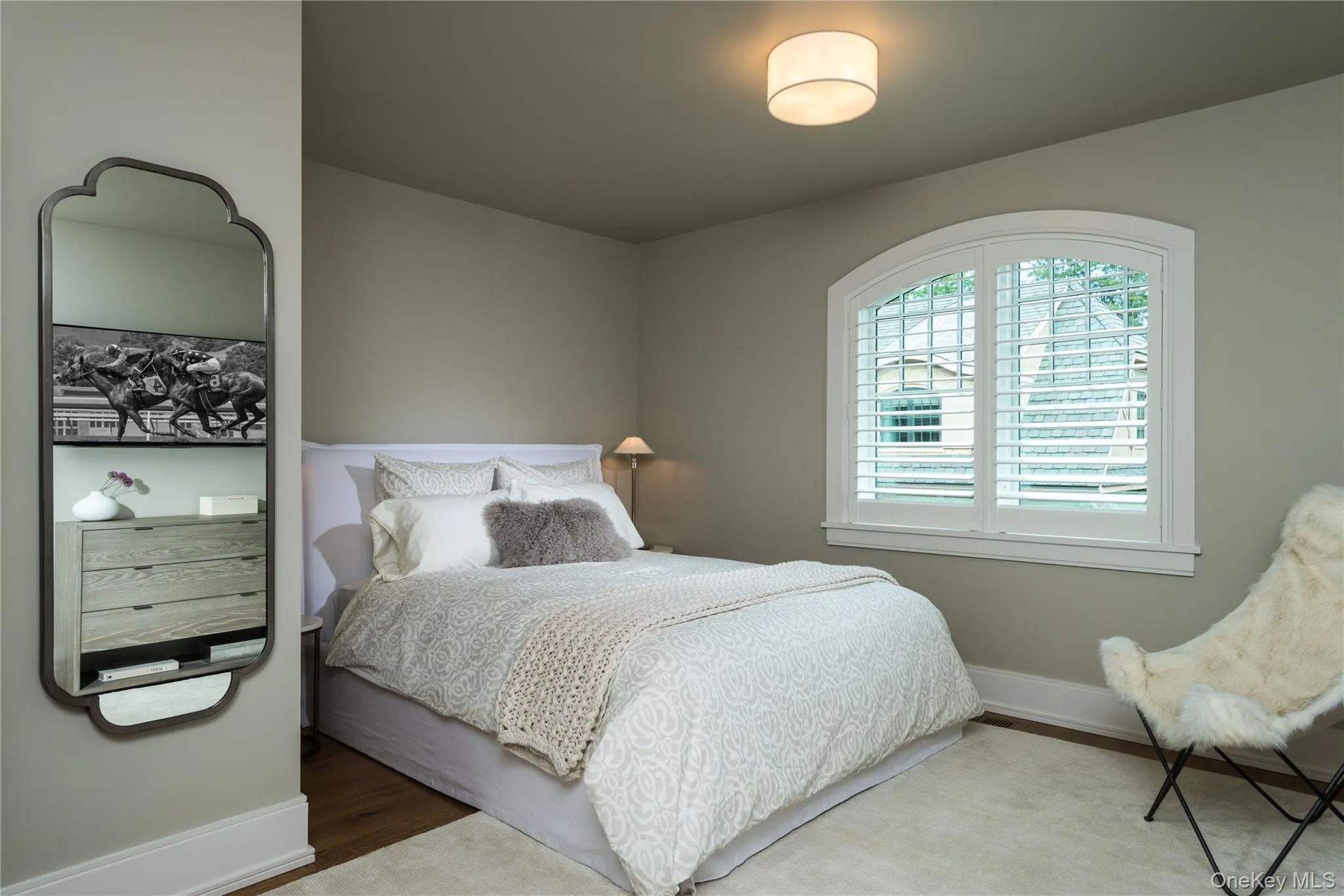 Bedroom with wood finished floors and baseboards Bedroom with wood finished floors and baseboards