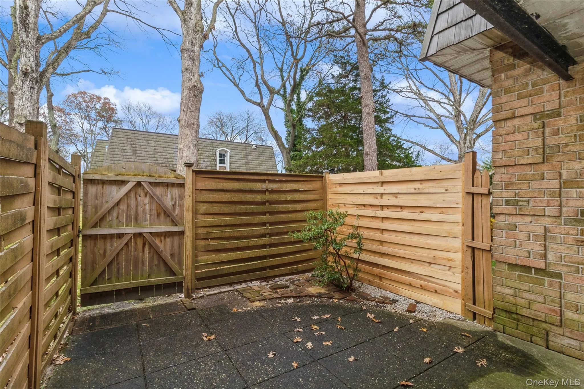 Gate featuring a patio Gate featuring a patio