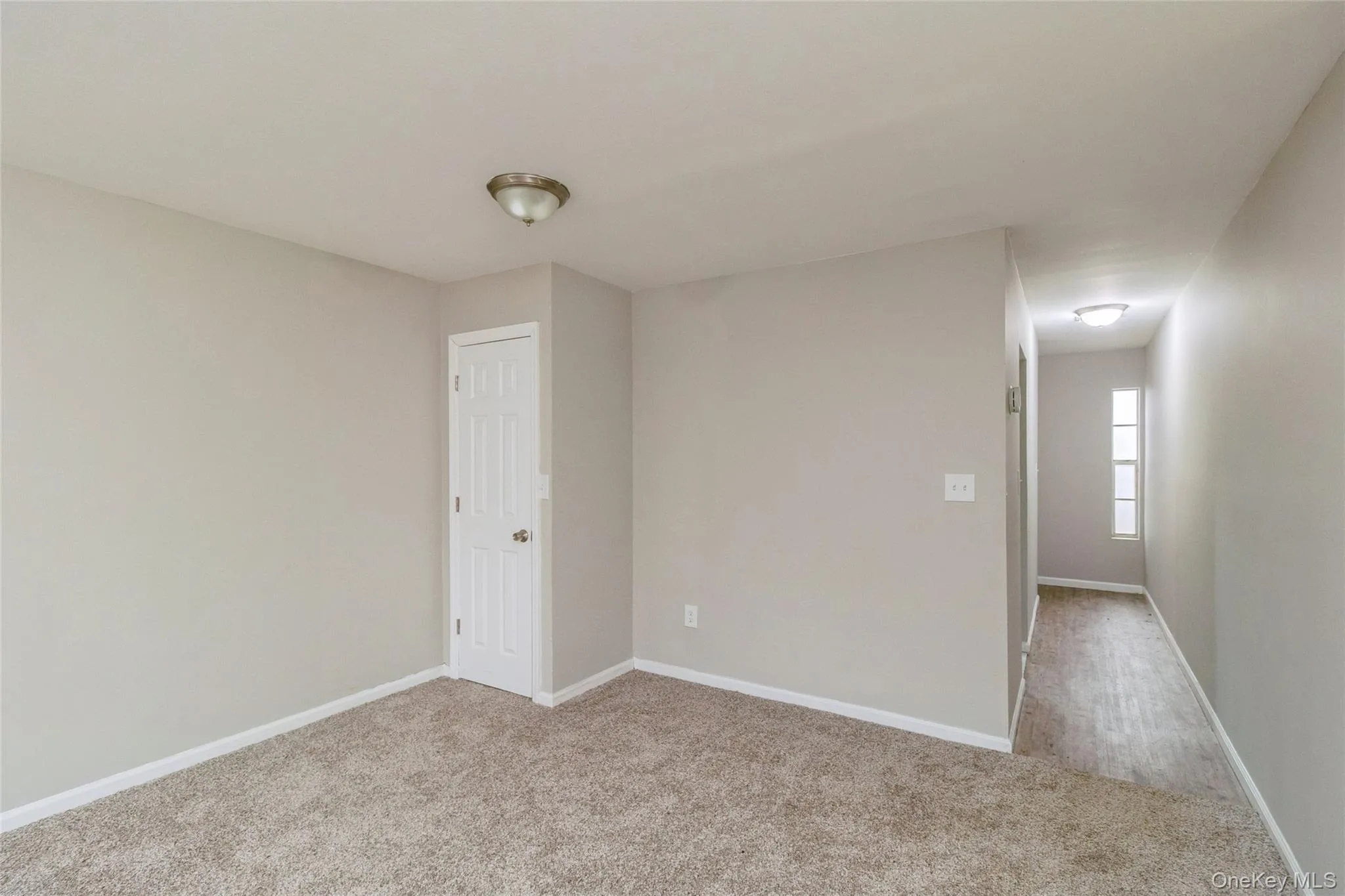 Unfurnished room with light colored carpet Unfurnished room with light colored carpet