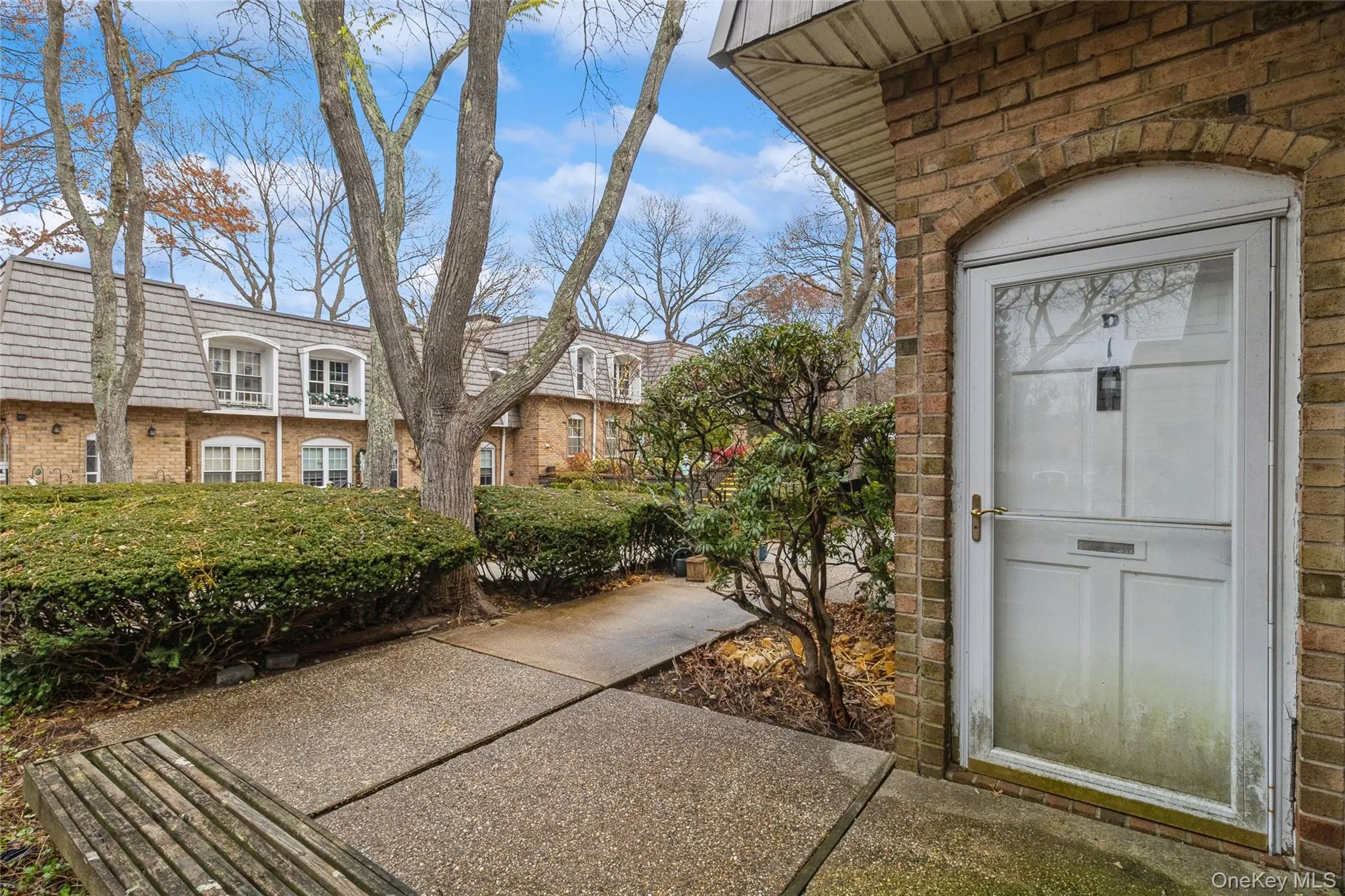 Property entrance featuring brick siding and stone siding Property entrance featuring brick siding and stone siding