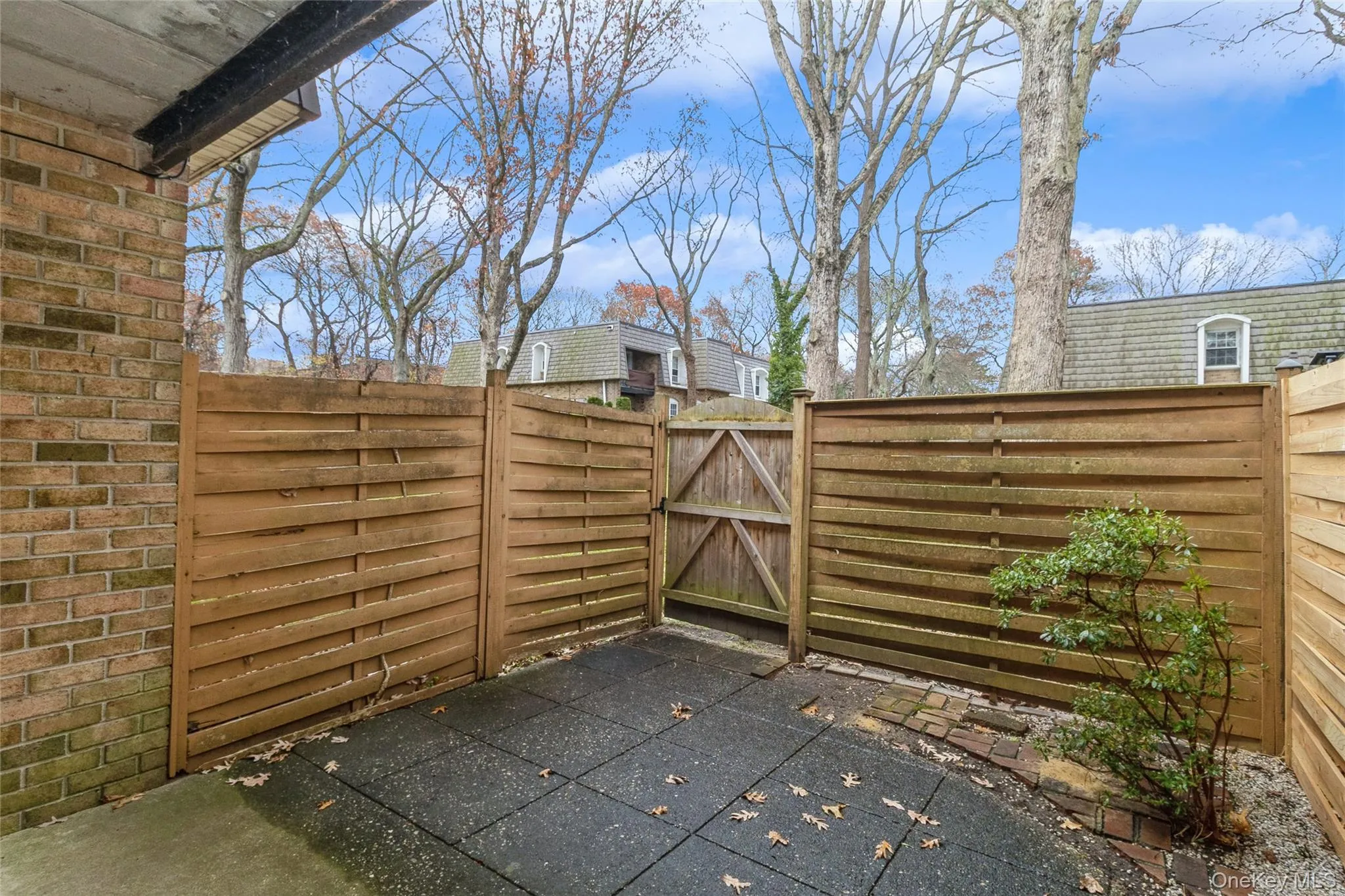 View of patio featuring a gate View of patio featuring a gate