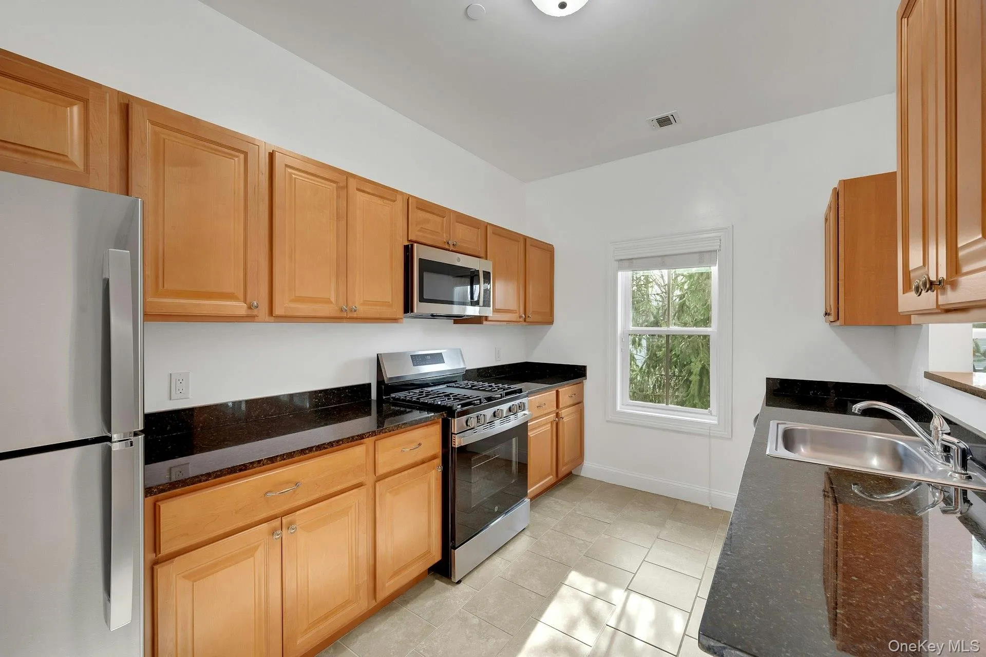 Kitchen featuring new stainless steel appliances. Kitchen featuring new stainless steel appliances.