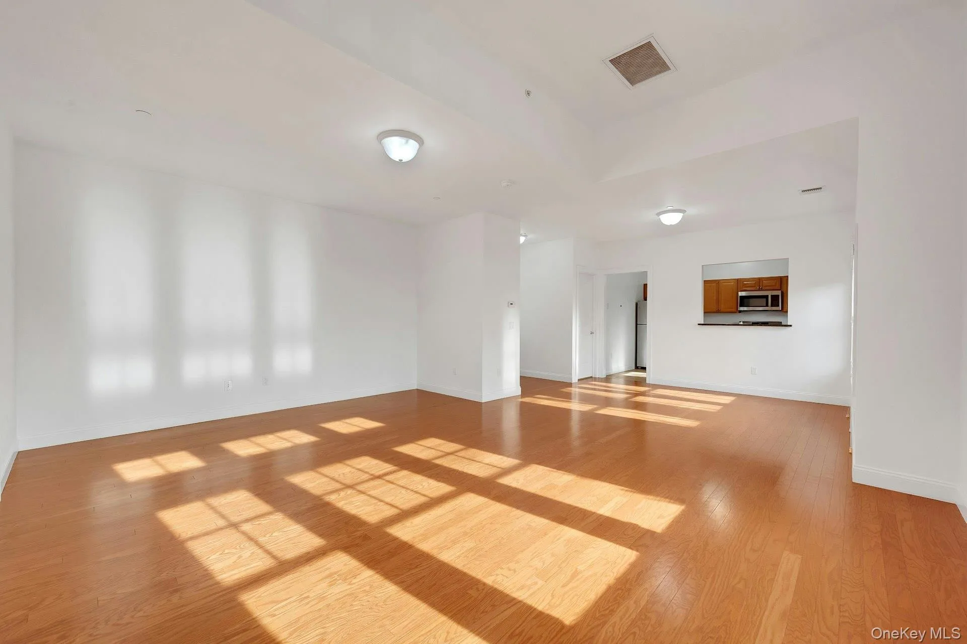 View of the living room dining area into the kitchen View of the living room dining area into the kitchen