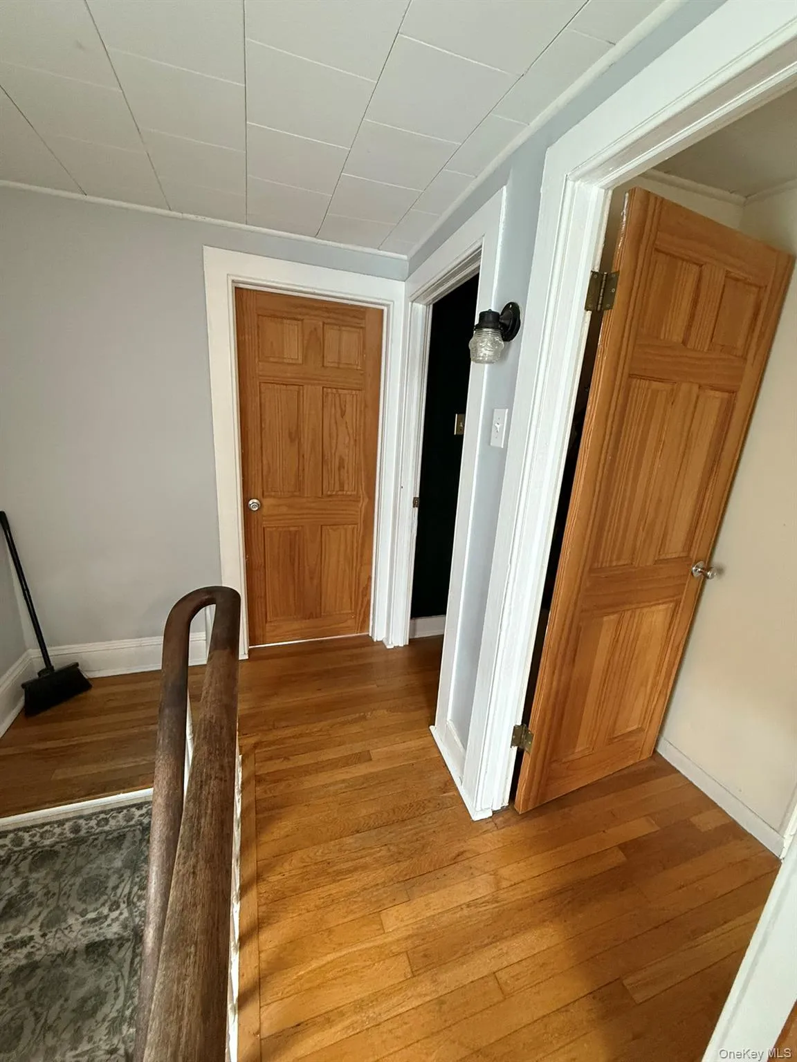 Hall featuring wood-type flooring Hall featuring wood-type flooring