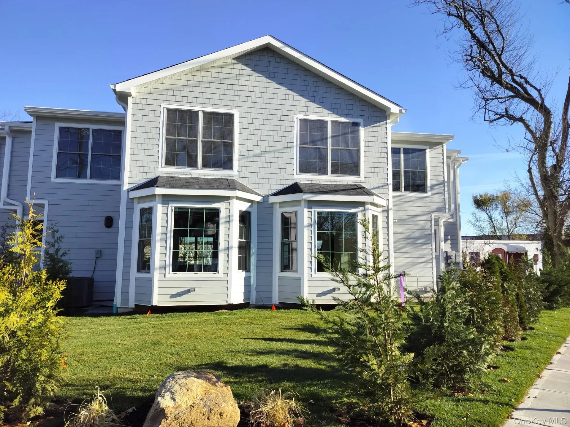 Rear view of house featuring a yard Rear view of house featuring a yard