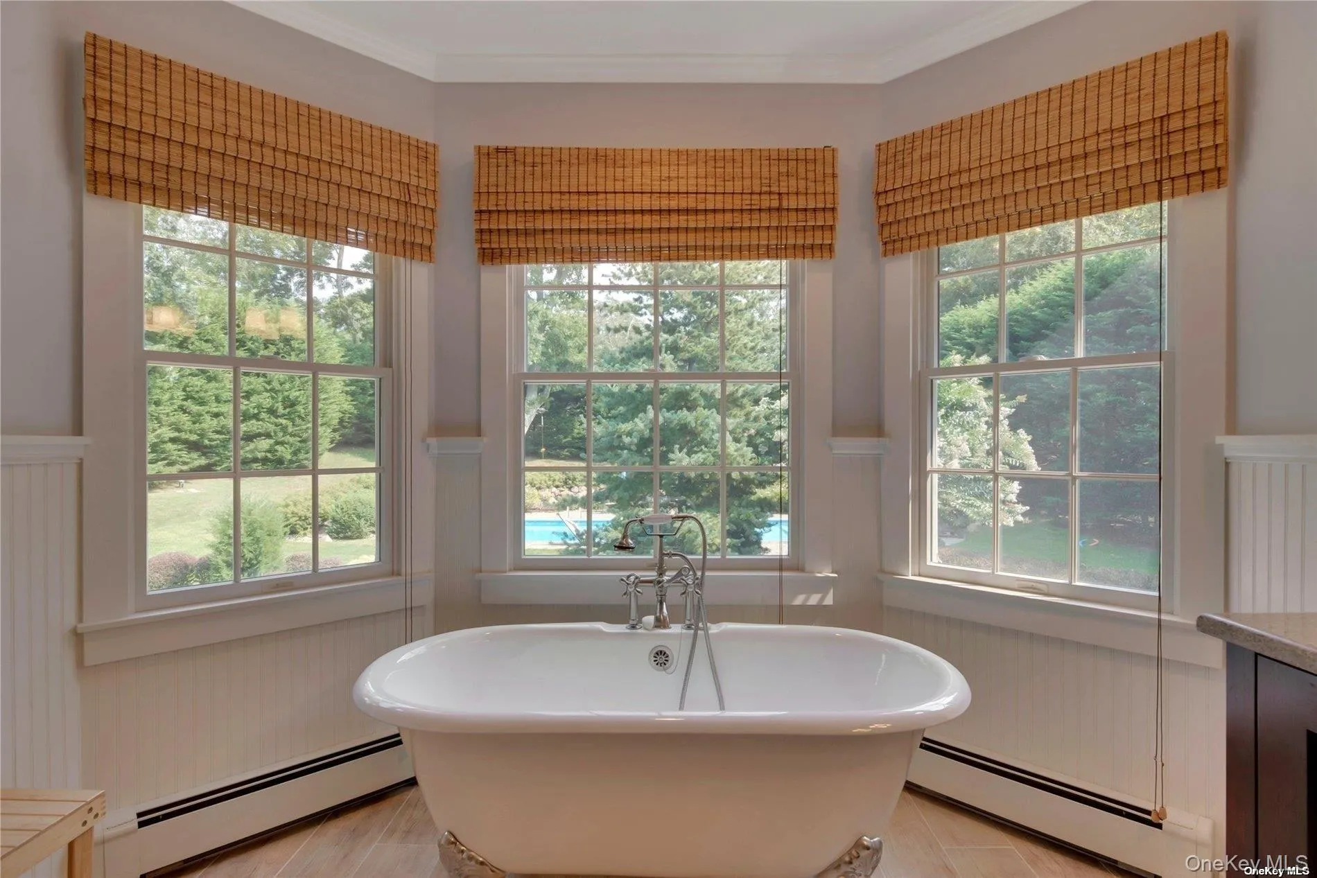 Soaking tub with beautiful view of rear yard Soaking tub with beautiful view of rear yard