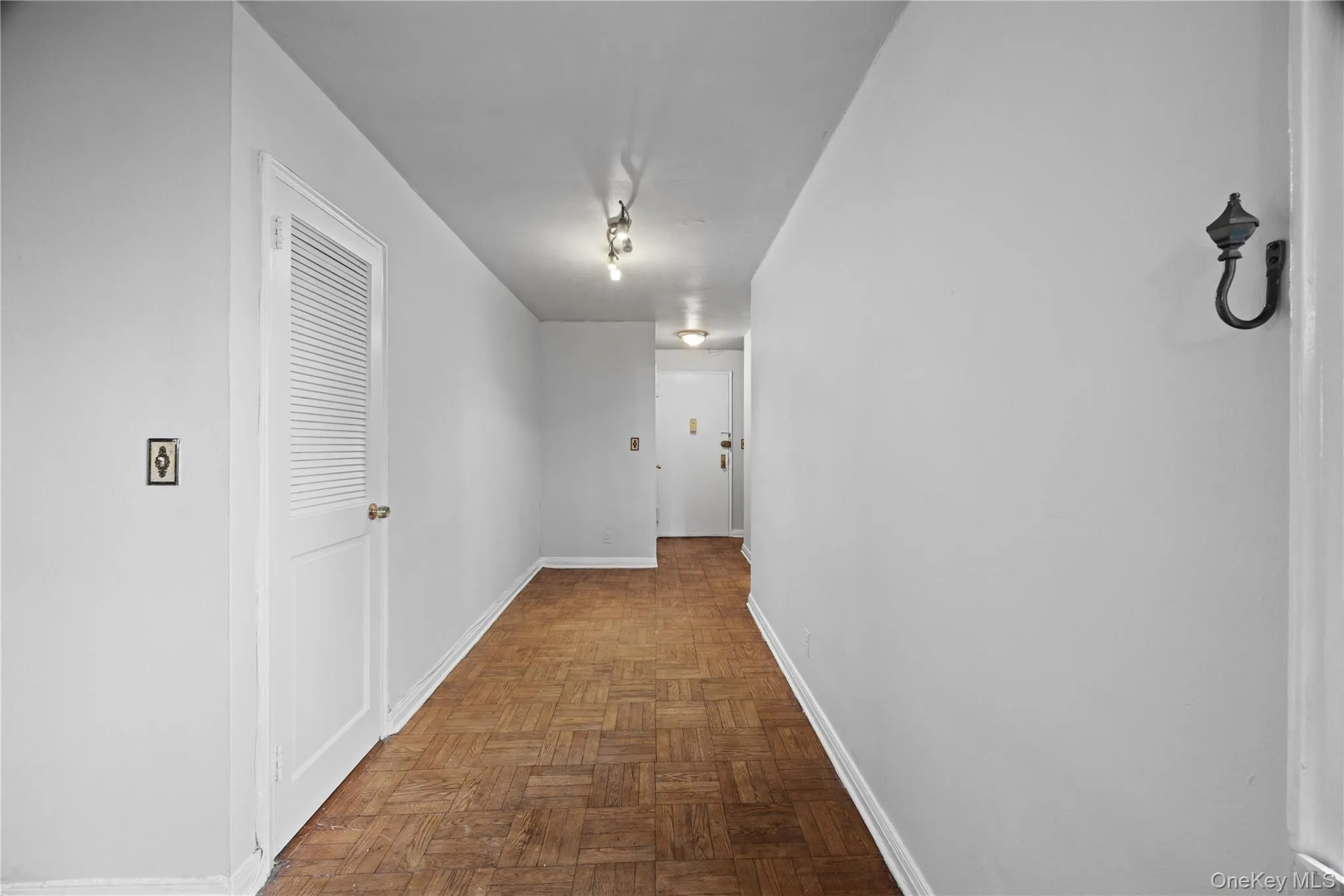 Hallway featuring baseboards Hallway featuring baseboards