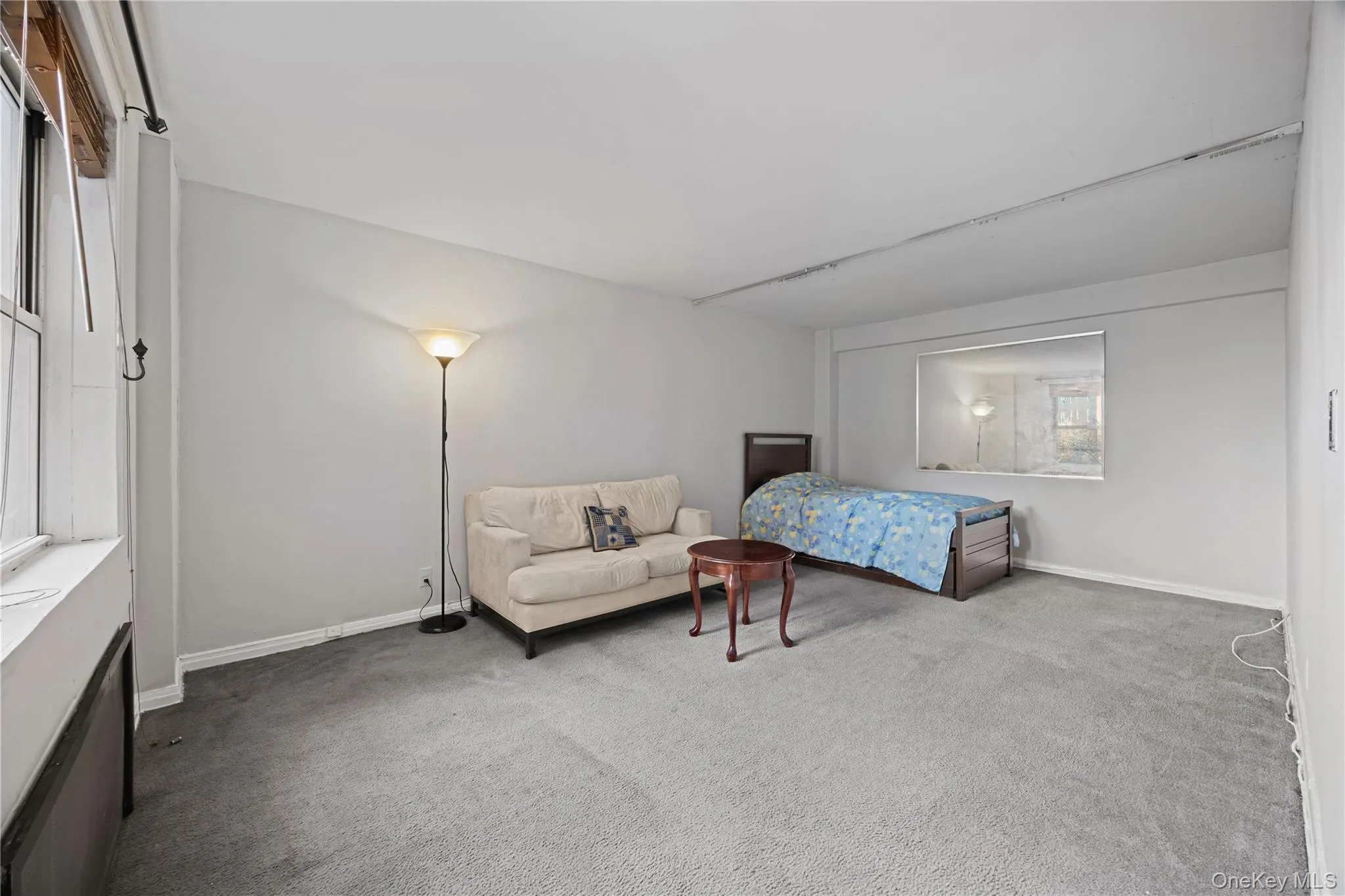 Carpeted bedroom with baseboards Carpeted bedroom with baseboards