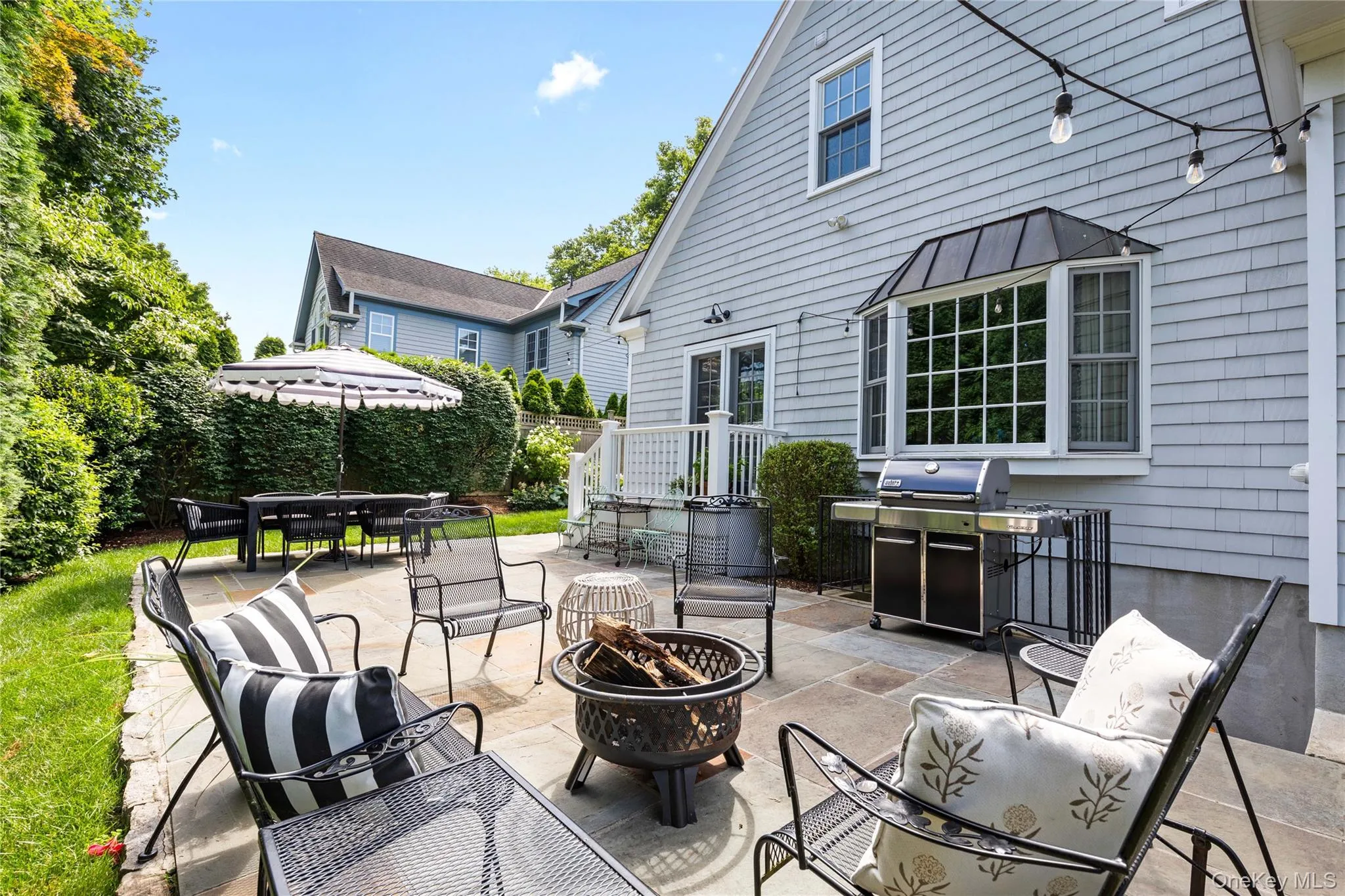 View of patio / terrace featuring a fire pit, a grill, and outdoor dining space View of patio / terrace featuring a fire pit, a grill, and outdoor dining space