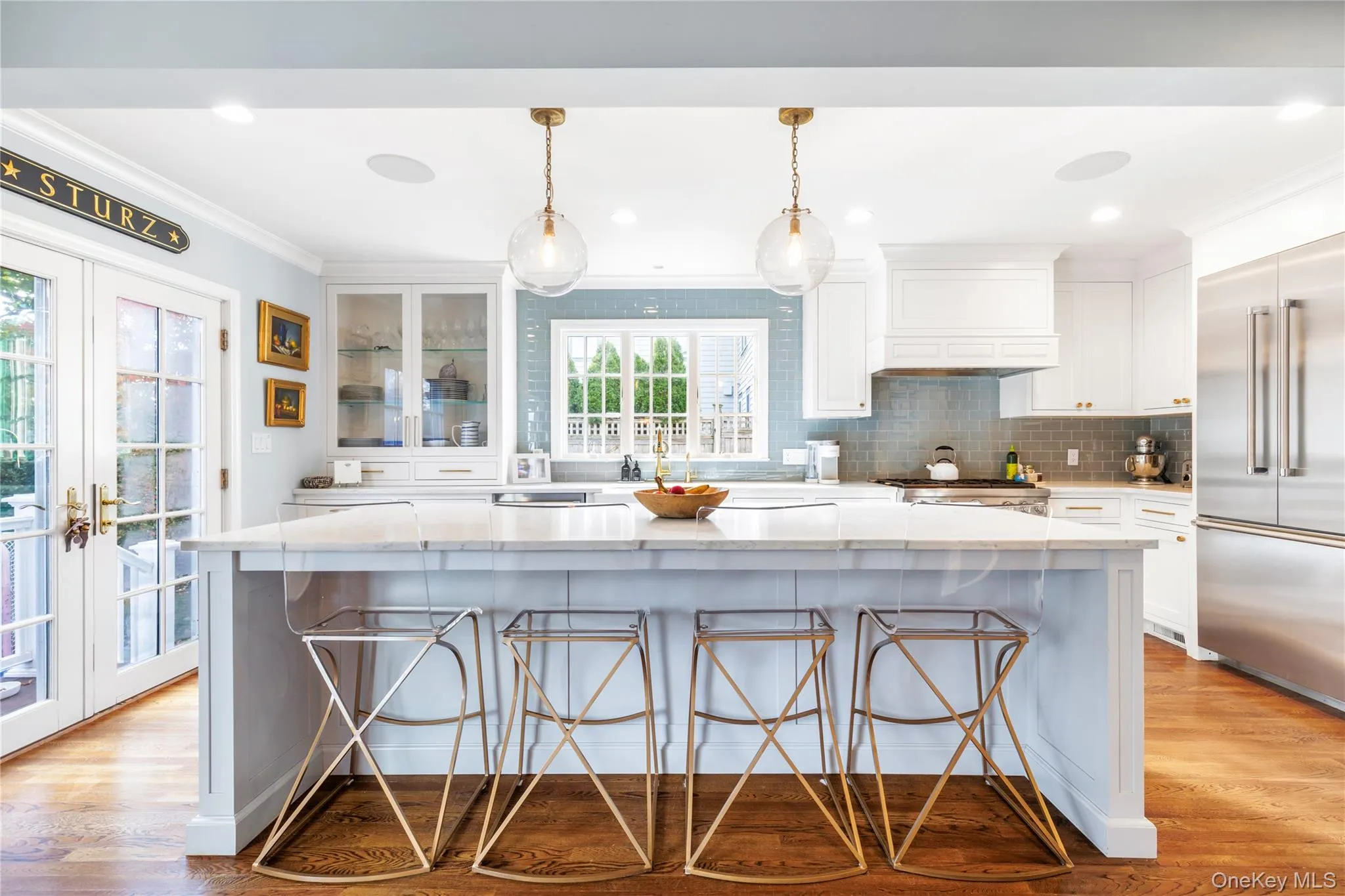 Chef's kitchen opening up to back patio for grilling and entertaining Chef's kitchen opening up to back patio for grilling and entertaining