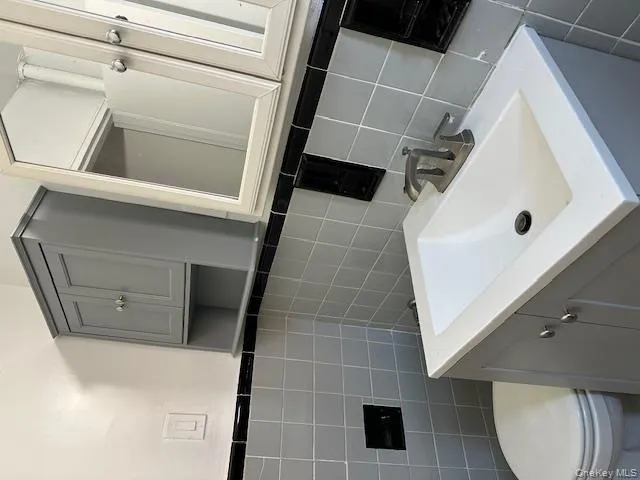 Bathroom with vanity and tile walls Bathroom with vanity and tile walls