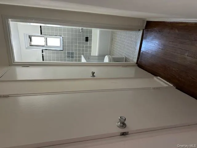 Bathroom with dark wood finished floors, shower / tub combination, and vanity Bathroom with dark wood finished floors, shower / tub combination, and vanity