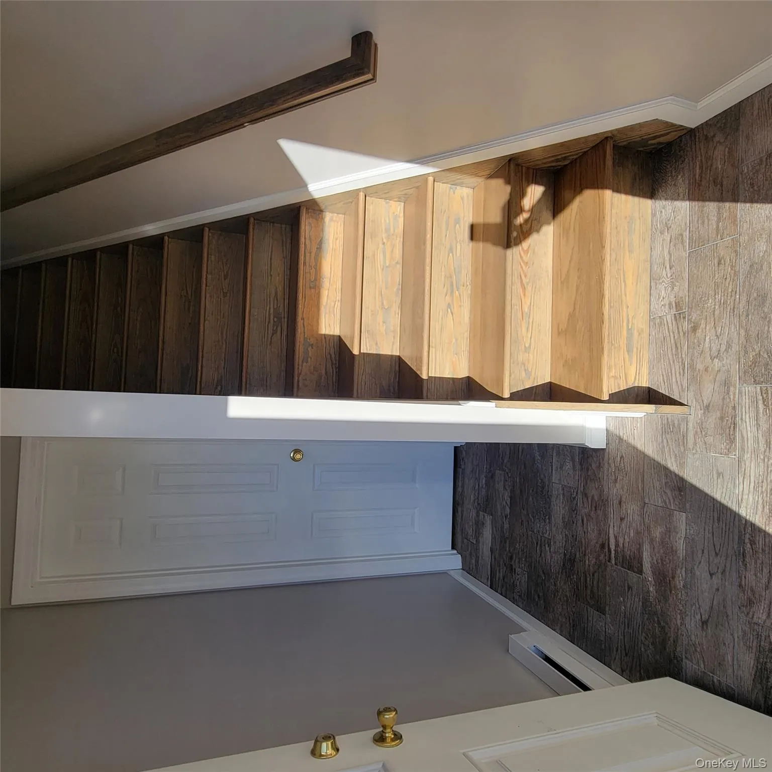 Stairway with baseboards and a baseboard heating unit Stairway with baseboards and a baseboard heating unit