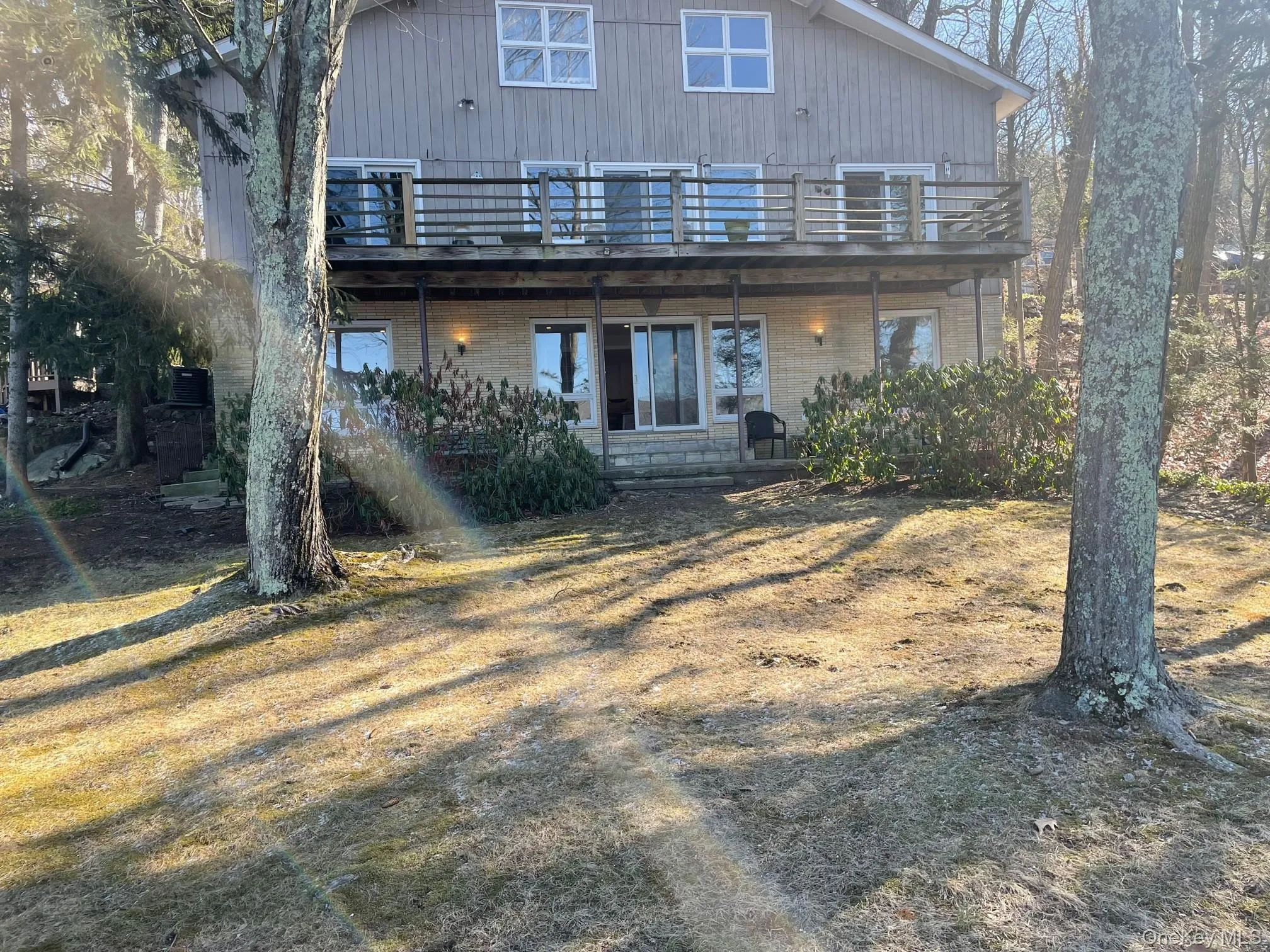Rear view of property featuring a wooden deck Rear view of property featuring a wooden deck