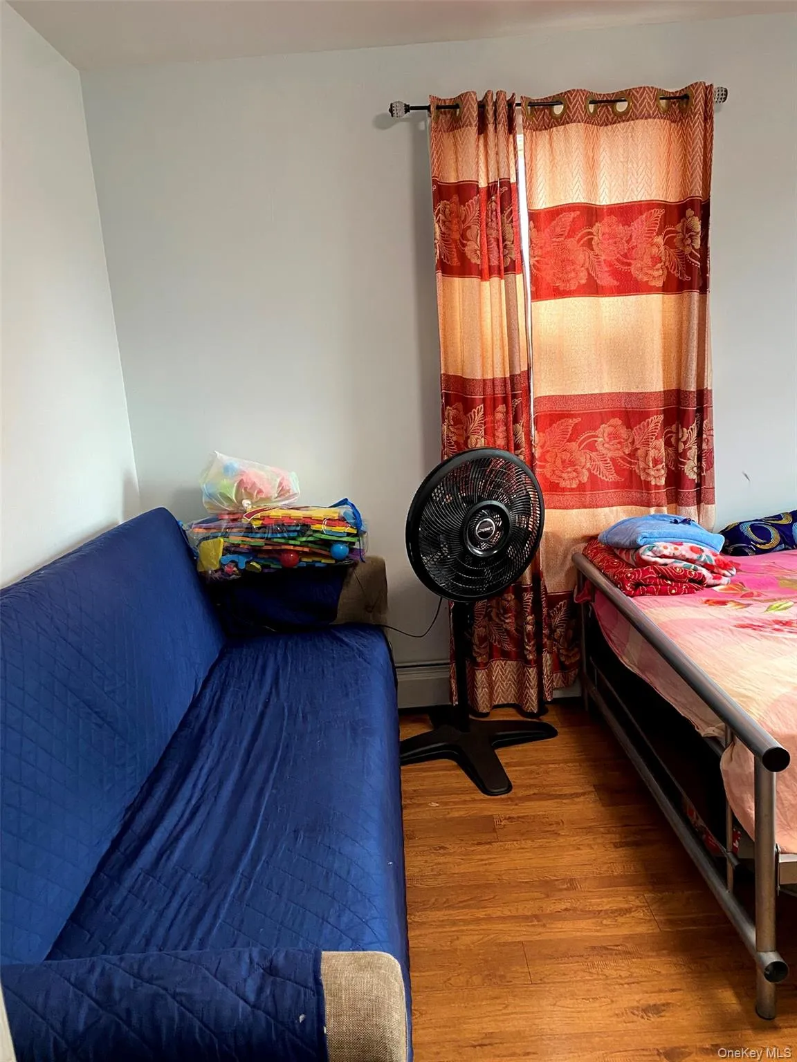 Bedroom featuring wood finished floors Bedroom featuring wood finished floors