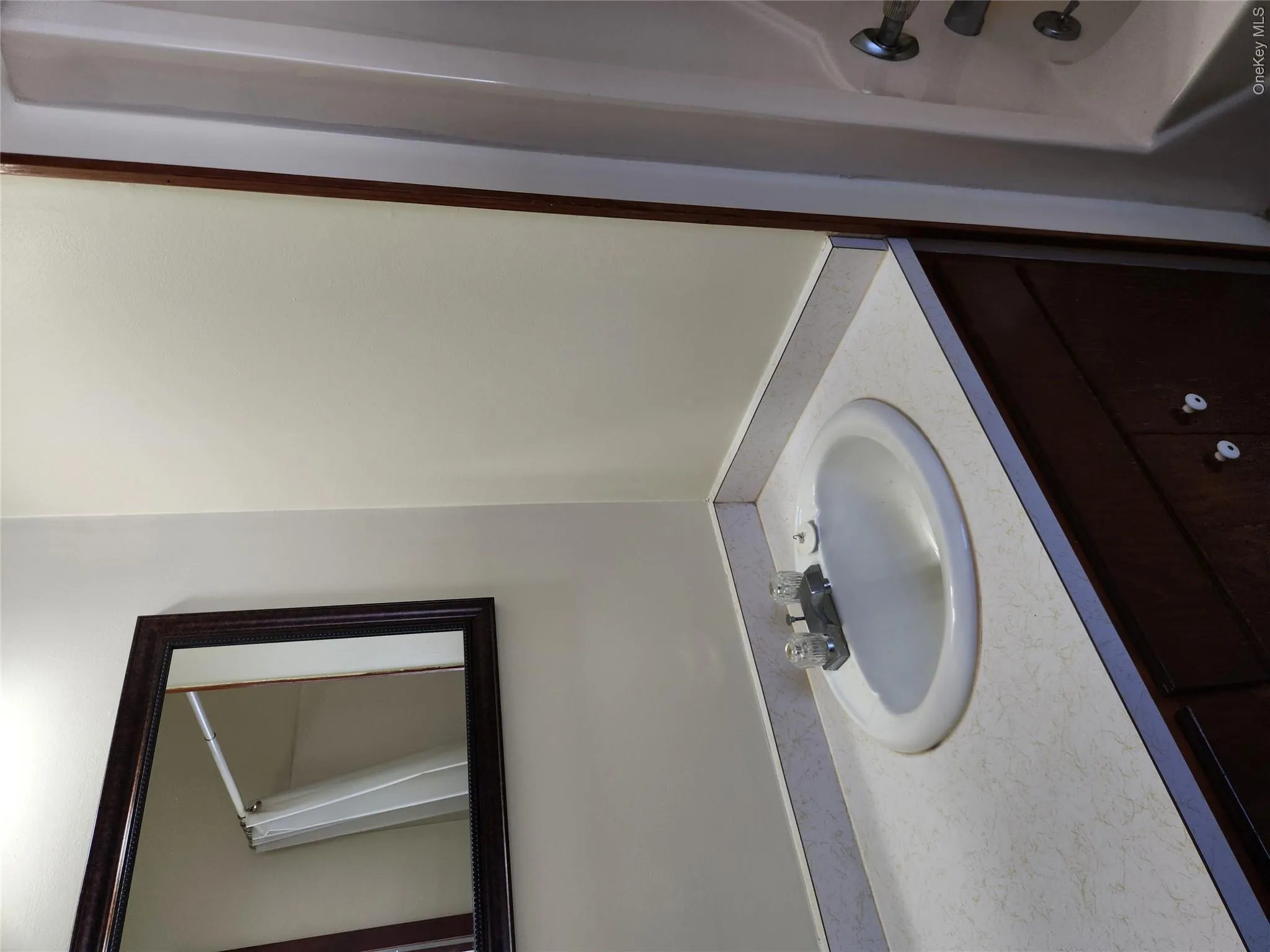 Full bathroom with vanity and shower / bath combo with shower curtain Full bathroom with vanity and shower / bath combo with shower curtain