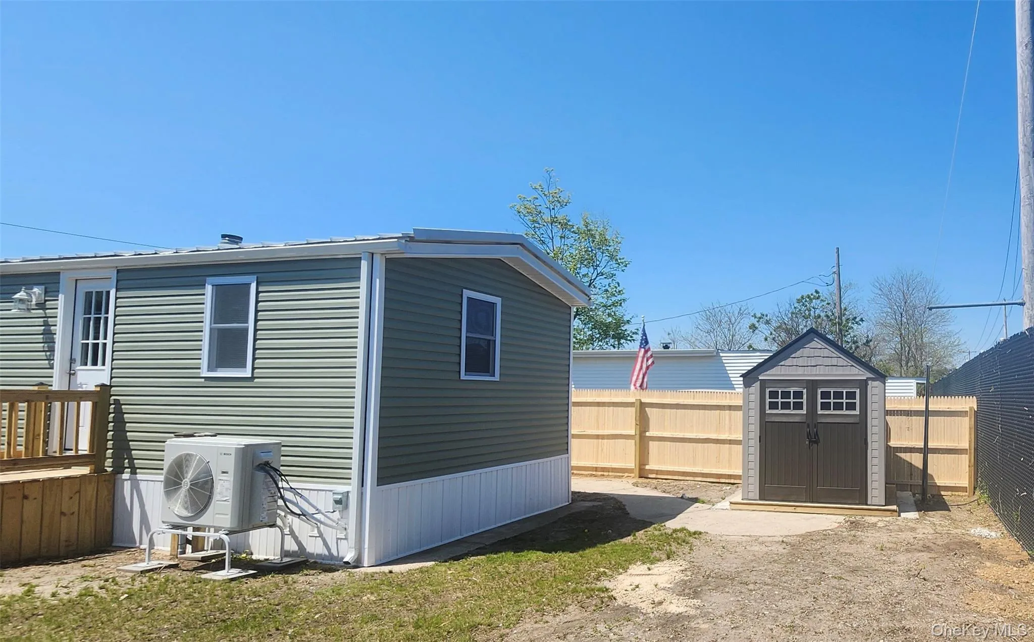 View of backyard of home featuring New Roof, New Siding , New Windows, New Fence and New Shed View of backyard of home featuring New Roof, New Siding , New Windows, New Fence and New Shed