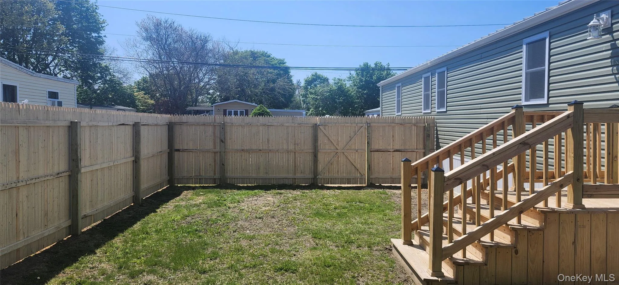 View of Side and Backyard of home featuring New Roof, New Siding , New Windows, New Steps and a New Fence View of Side and Backyard of home featuring New Roof, New Siding , New Windows, New Steps and a New Fence