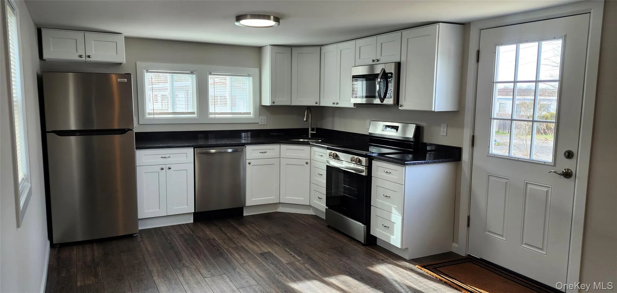 NEW Kitchen featuring Stainless Steel appliances, White Cabinets, Quartz Countertops, Vinyl Flooring NEW Kitchen featuring Stainless Steel appliances, White Cabinets, Quartz Countertops, Vinyl Flooring
