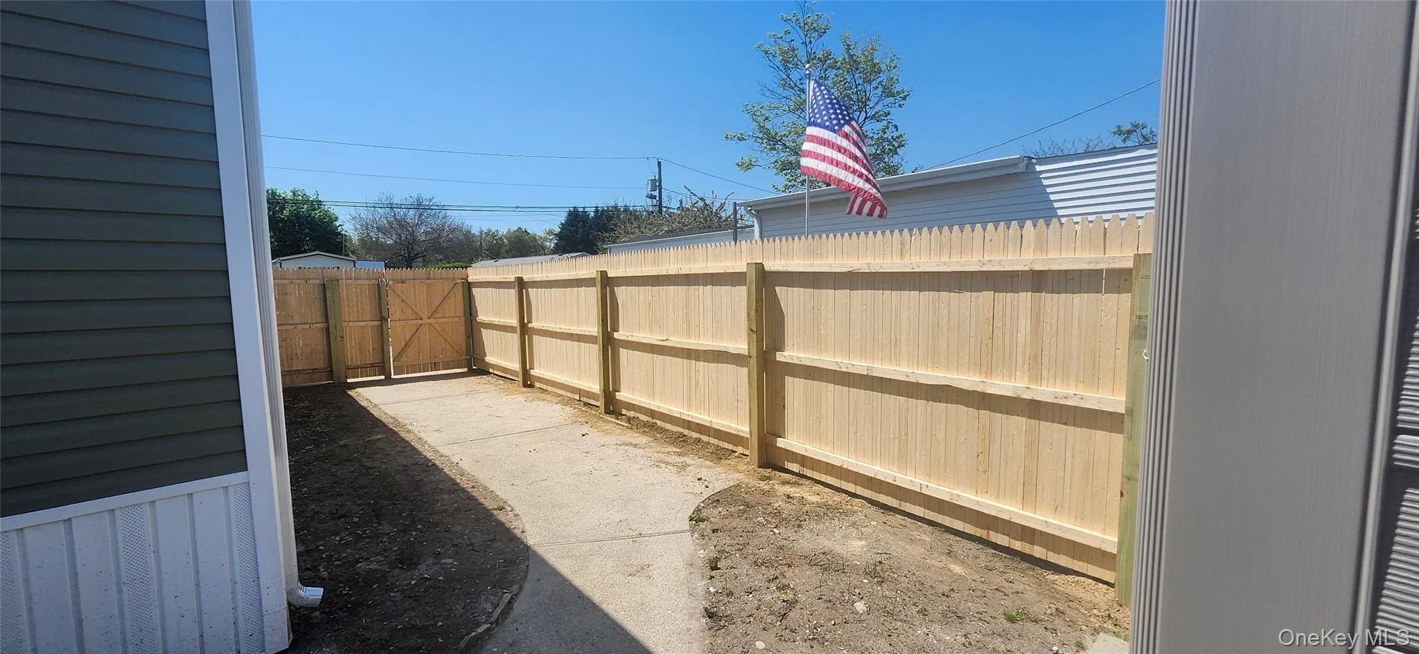 View of backyard of home featuring New Roof, New Siding , New Windows, New Fence and New Shed View of backyard of home featuring New Roof, New Siding , New Windows, New Fence and New Shed