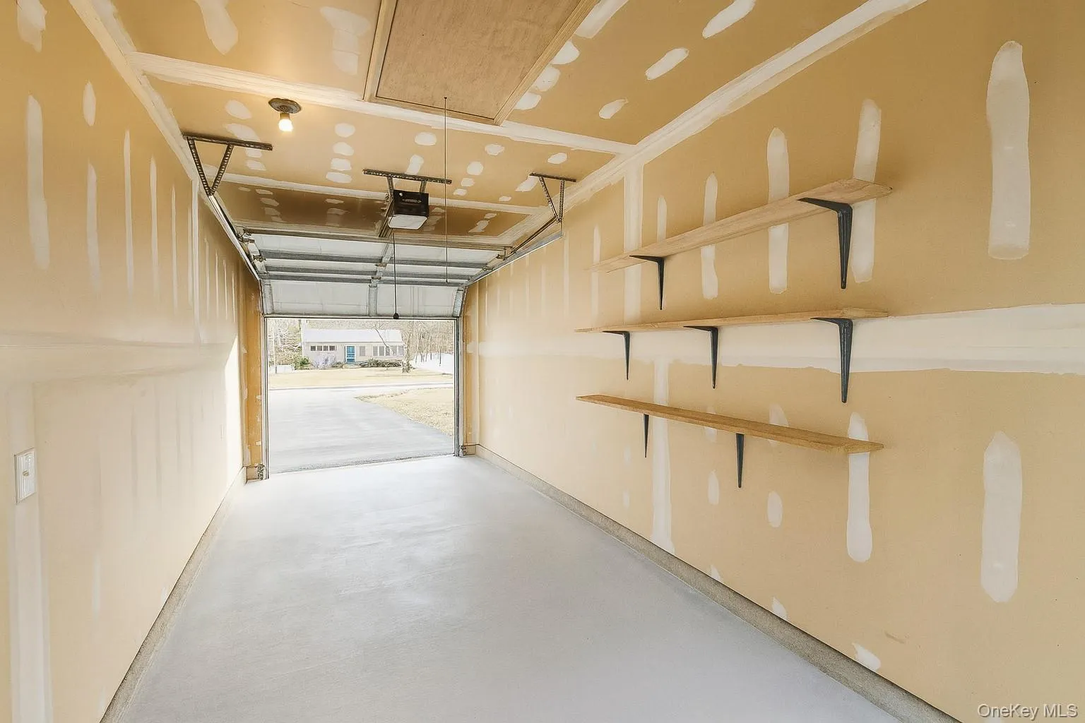 Garage featuring a garage door opener Garage featuring a garage door opener