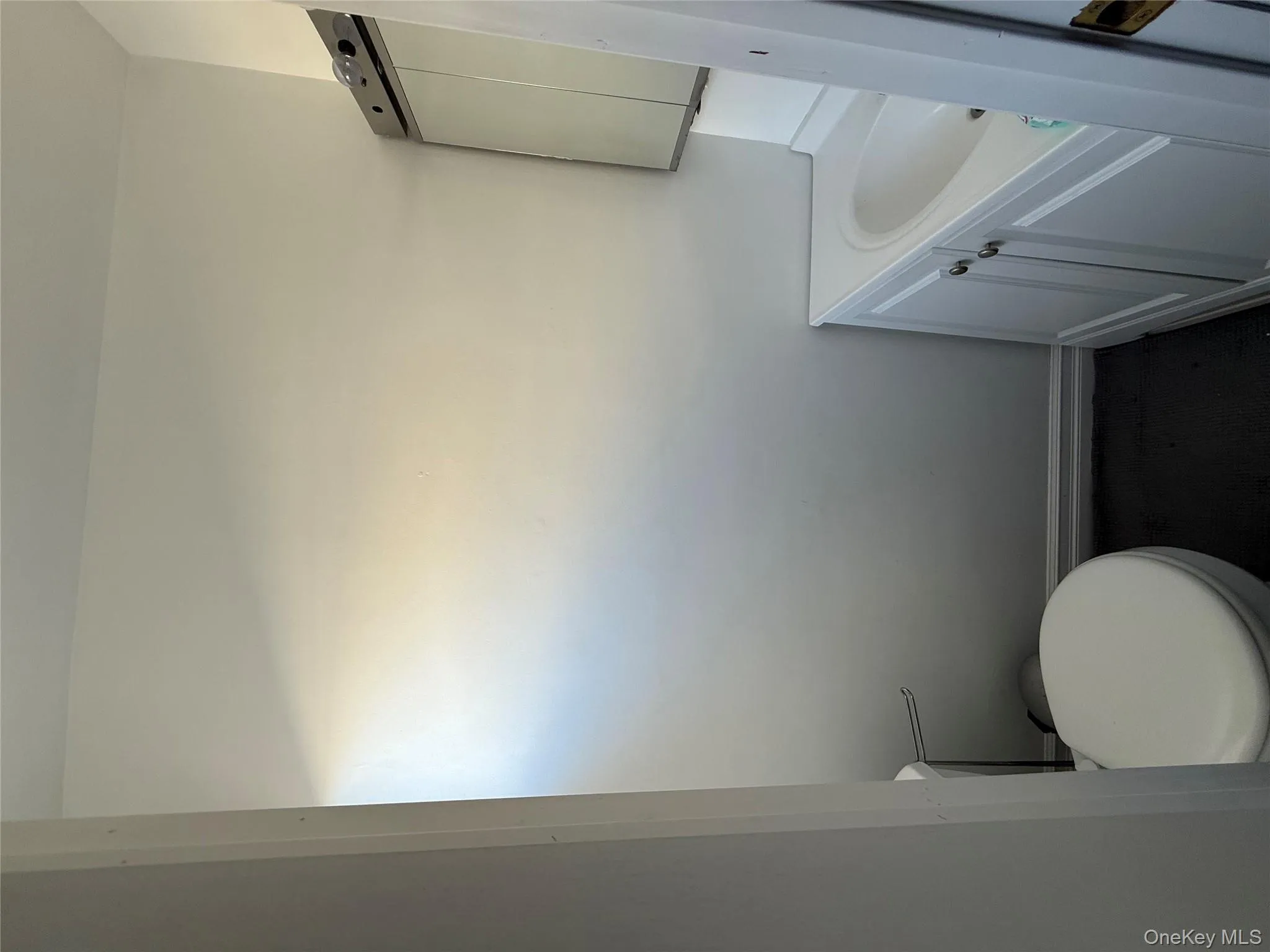 Bathroom featuring vanity and toilet Bathroom featuring vanity and toilet