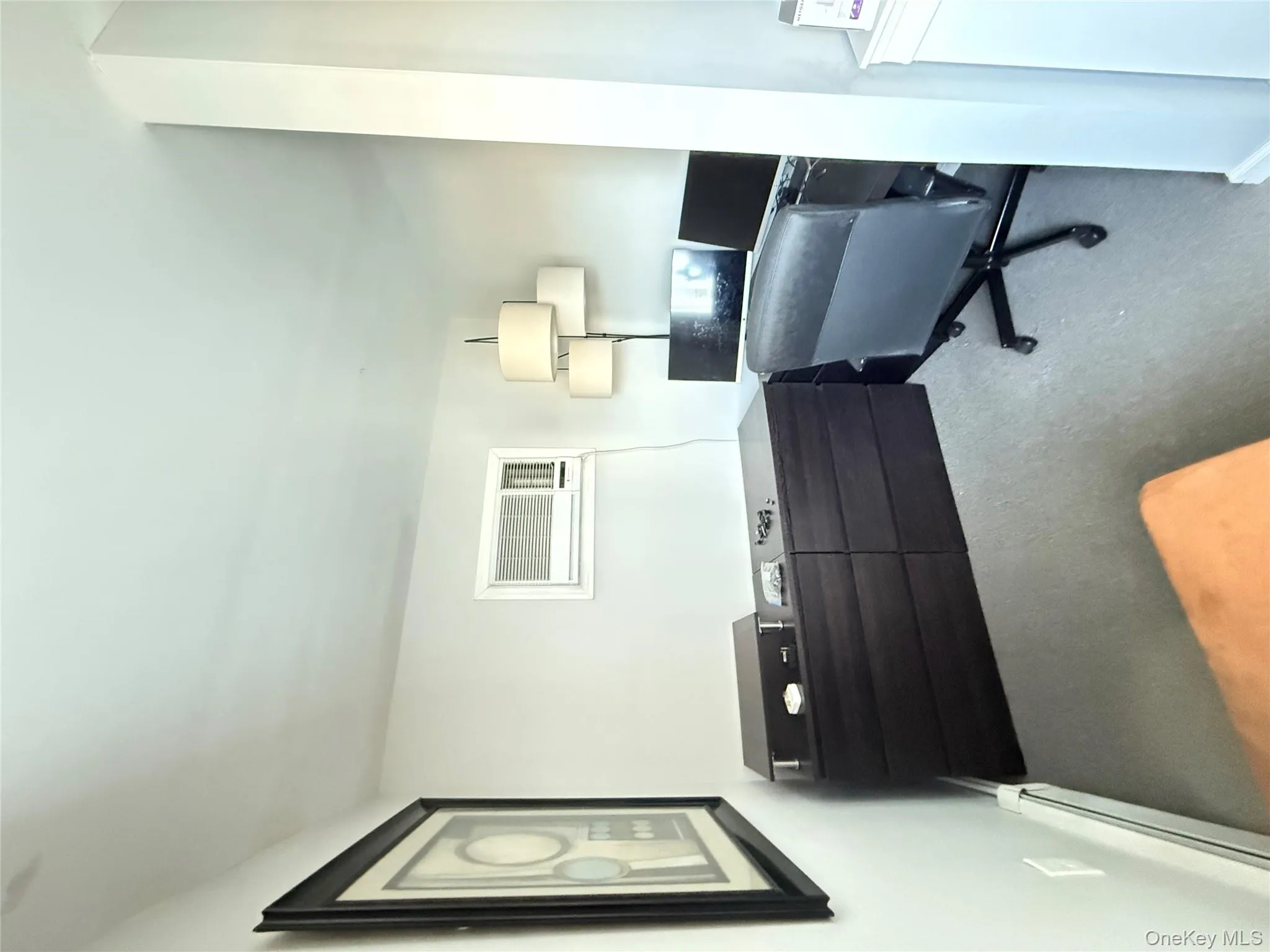 Office with a baseboard radiator and carpet flooring Office with a baseboard radiator and carpet flooring