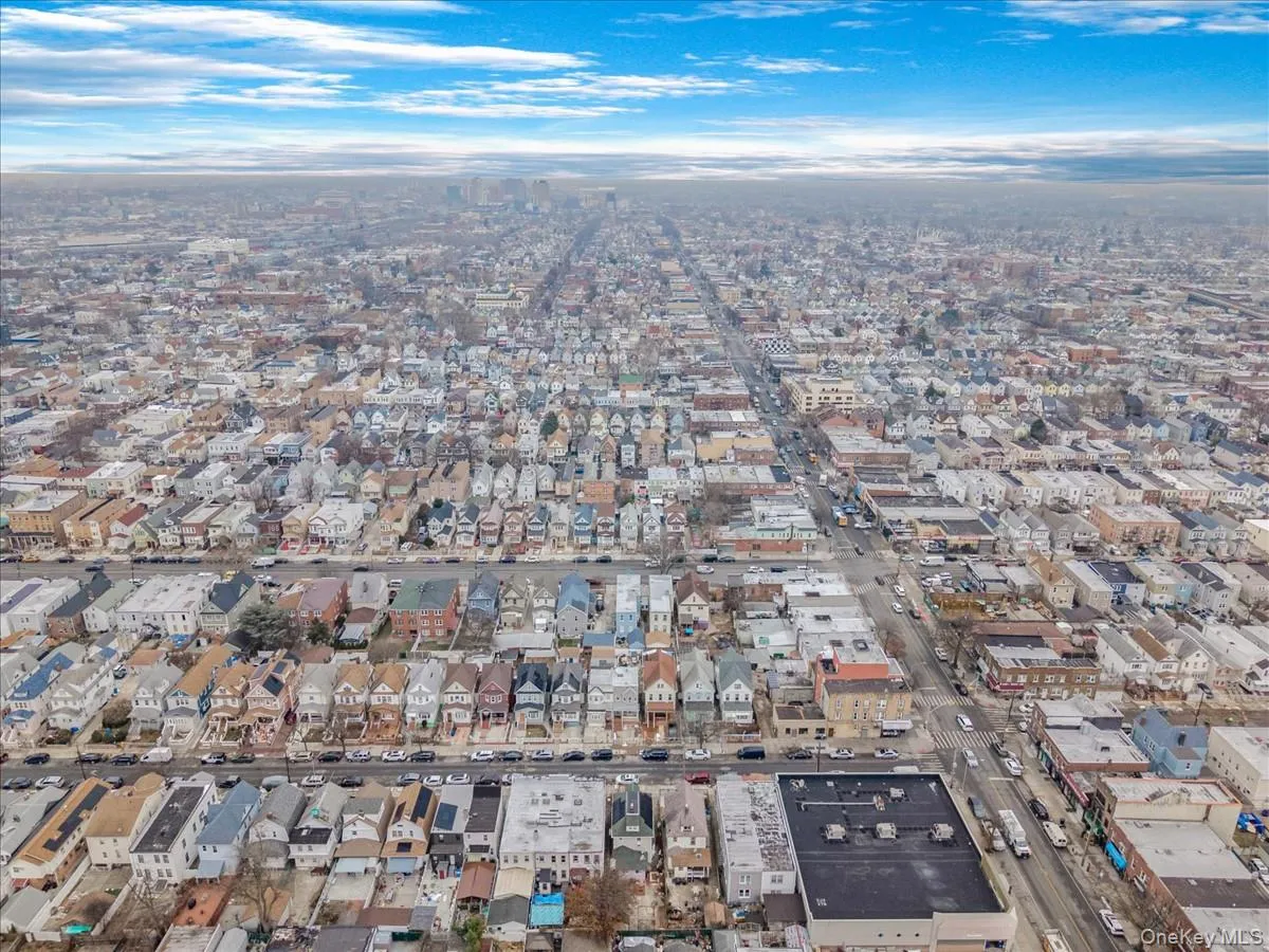 Aerial overview of property's location with nearby urban area Aerial overview of property's location with nearby urban area