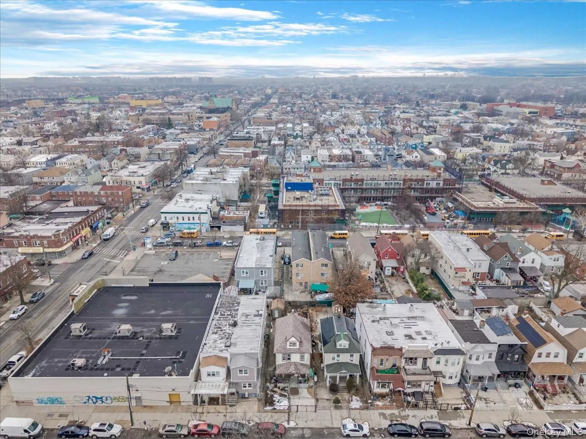 Aerial view of property's location featuring nearby urban area Aerial view of property's location featuring nearby urban area