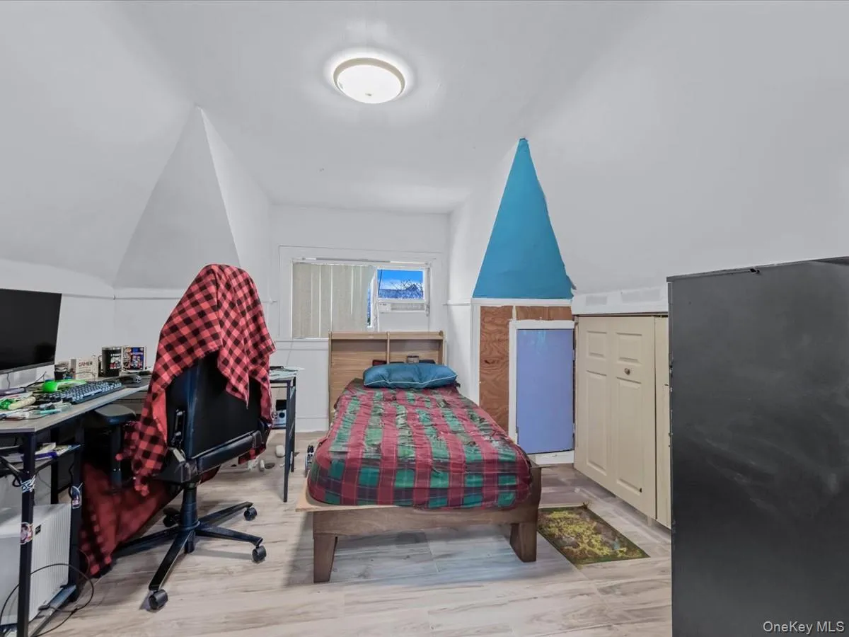 Bedroom featuring lofted ceiling Bedroom featuring lofted ceiling