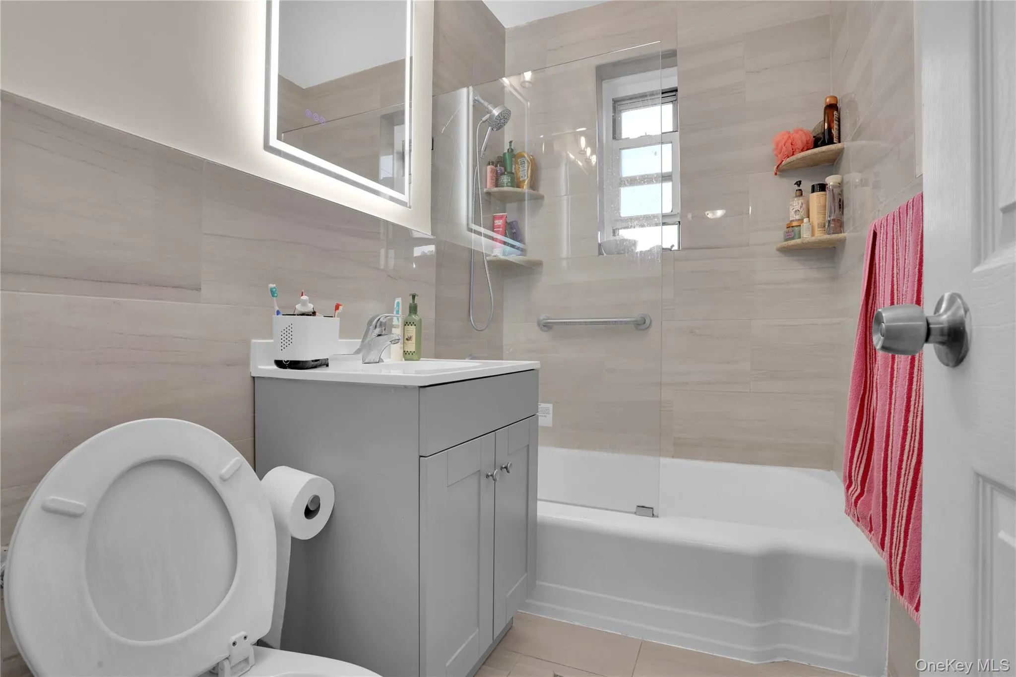 Full bath featuring vanity and bathing tub / shower combination Full bath featuring vanity and bathing tub / shower combination