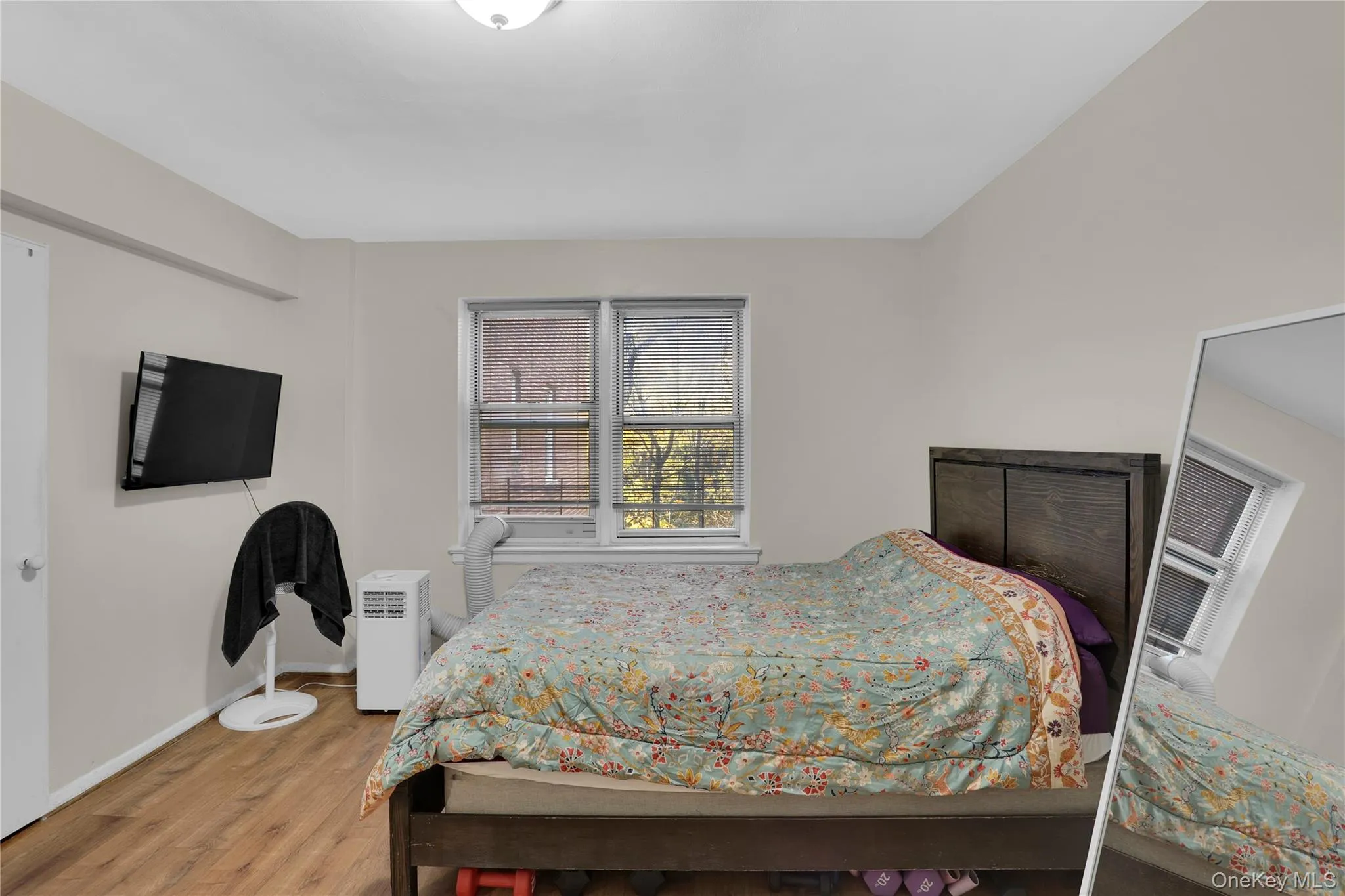 Bedroom with light wood-style floors and baseboards Bedroom with light wood-style floors and baseboards